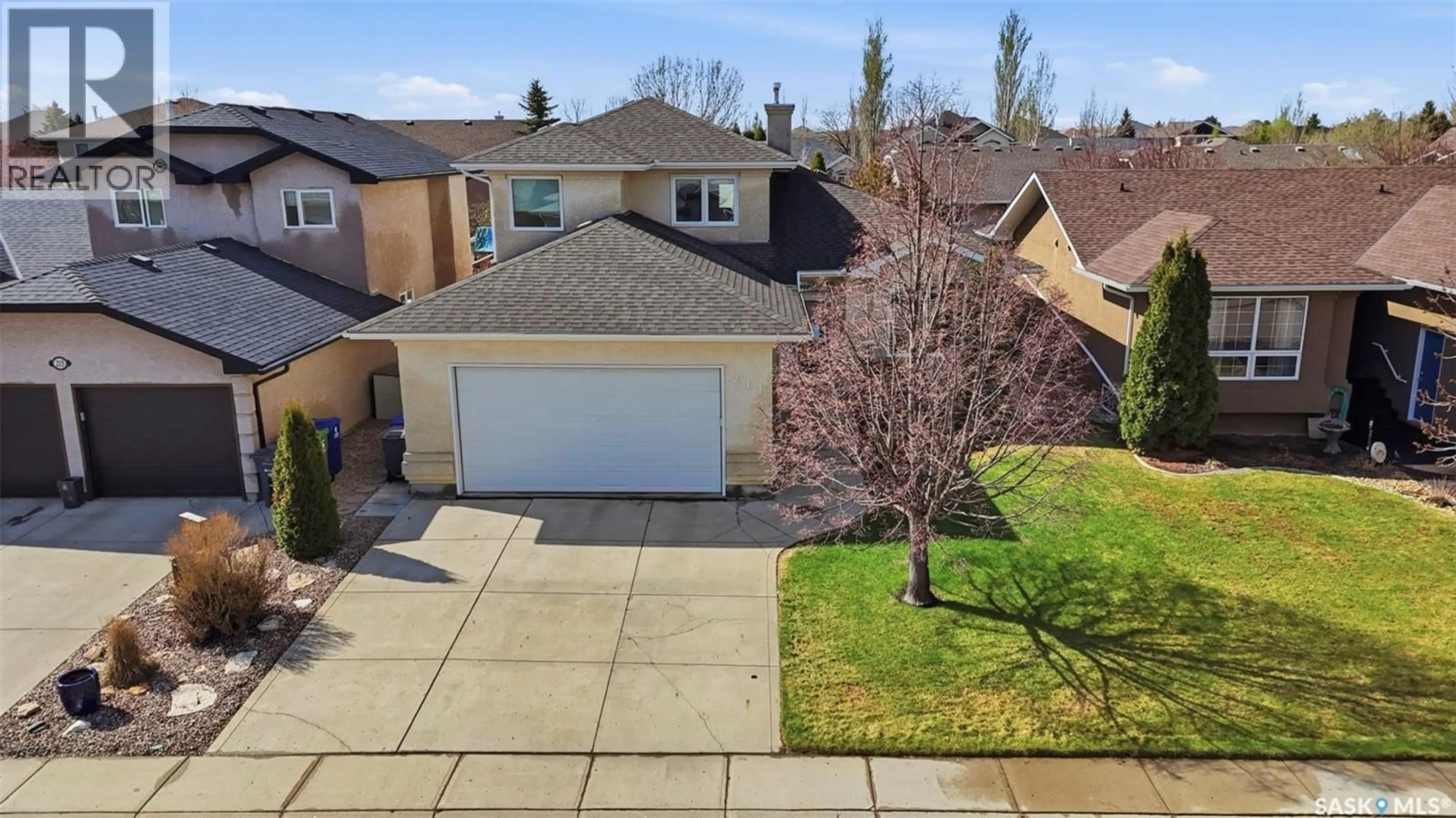 A pic from outside/outdoor area/front of a property/back of a property/a pic from drone, street for 211 BROOKMORE LANE, Saskatoon Saskatchewan S7V1C1