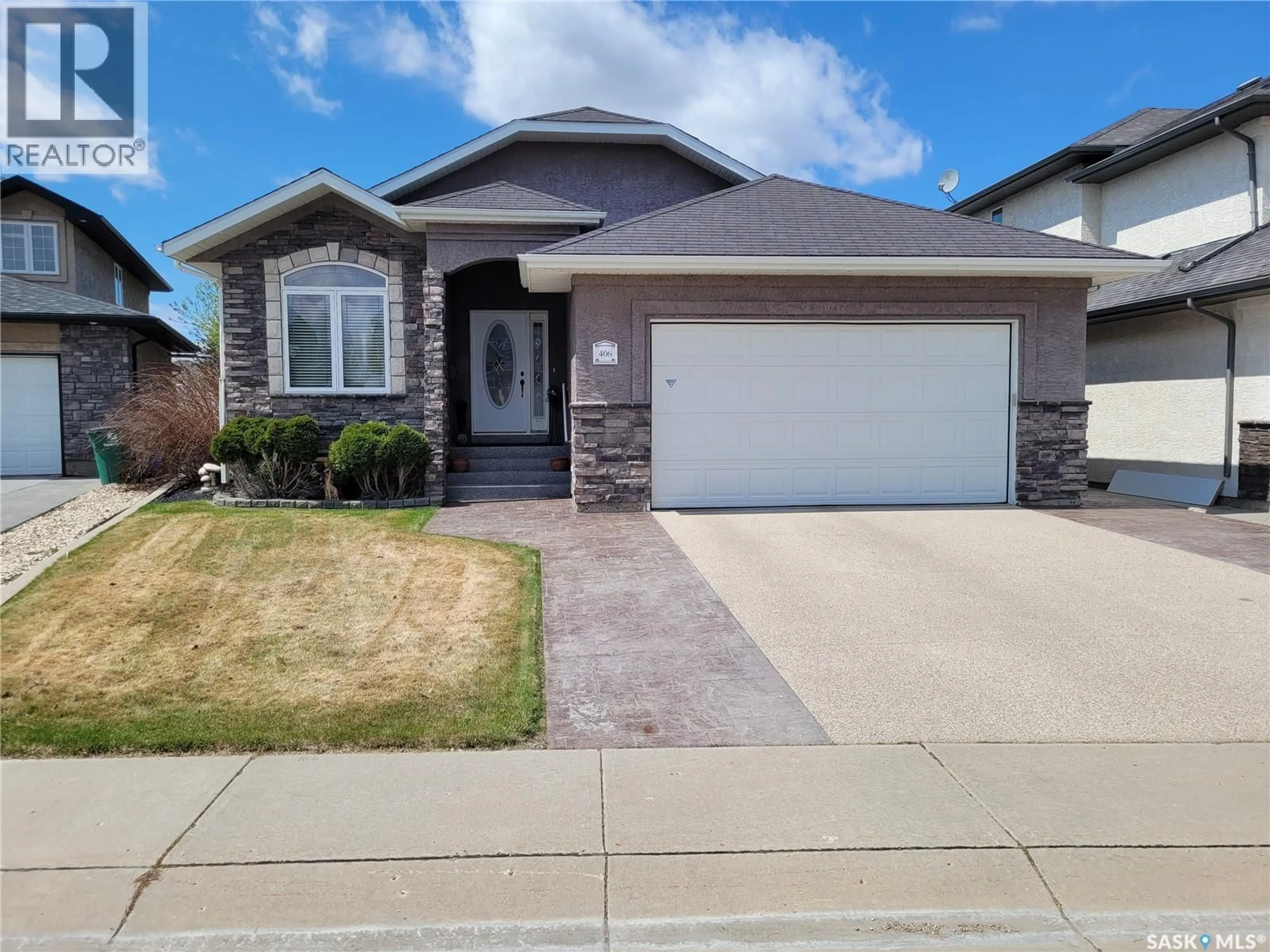 Home with brick exterior material, street for 406 BOLTON PLACE, Saskatoon Saskatchewan S7T0A2