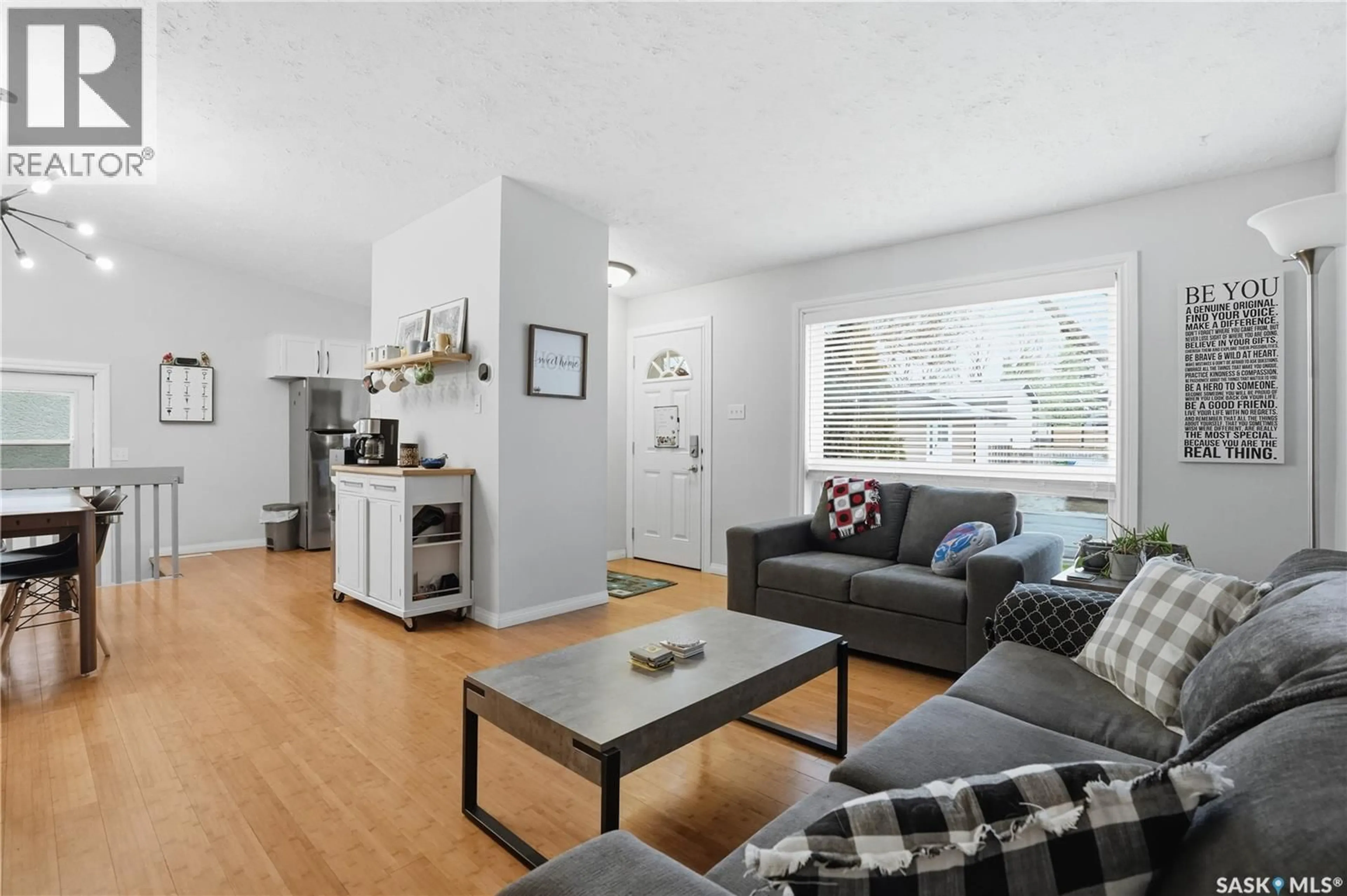 Living room with furniture, wood/laminate floor for 2838 HARTMANN CRESCENT, Regina Saskatchewan S4N6L9