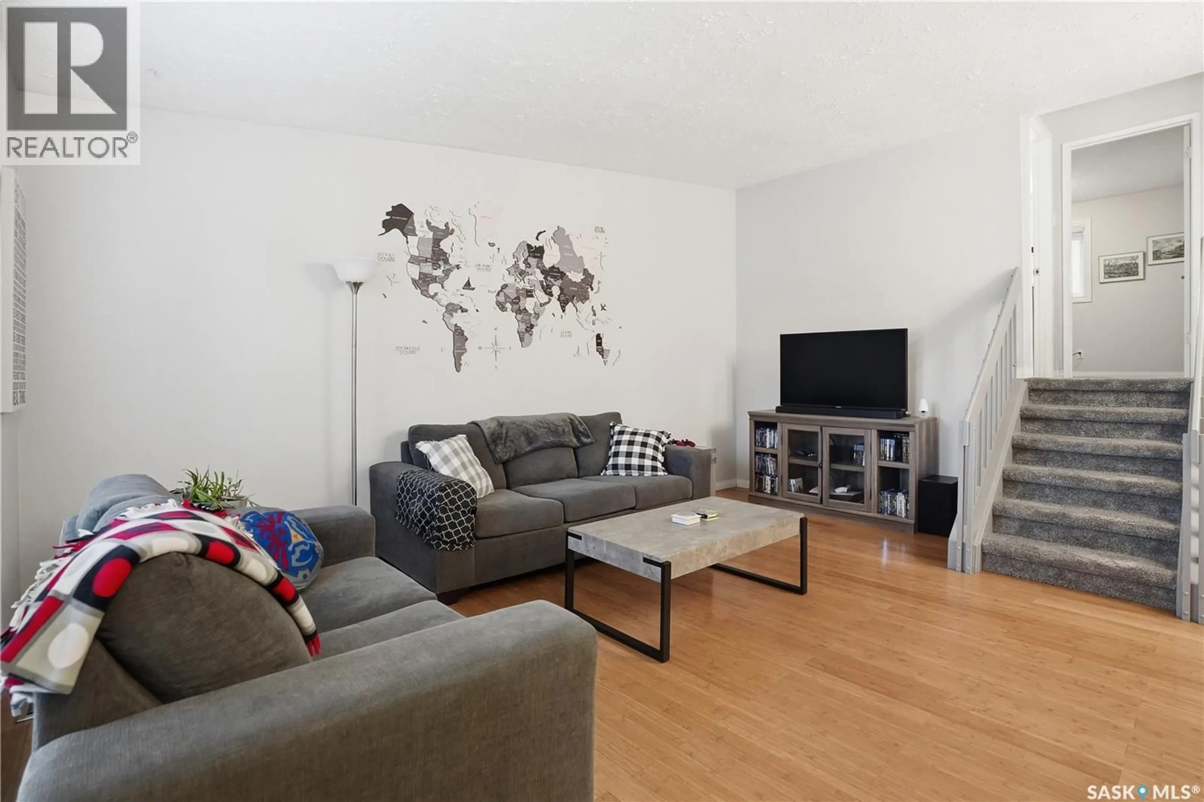 Living room with furniture, wood/laminate floor for 2838 HARTMANN CRESCENT, Regina Saskatchewan S4N6L9
