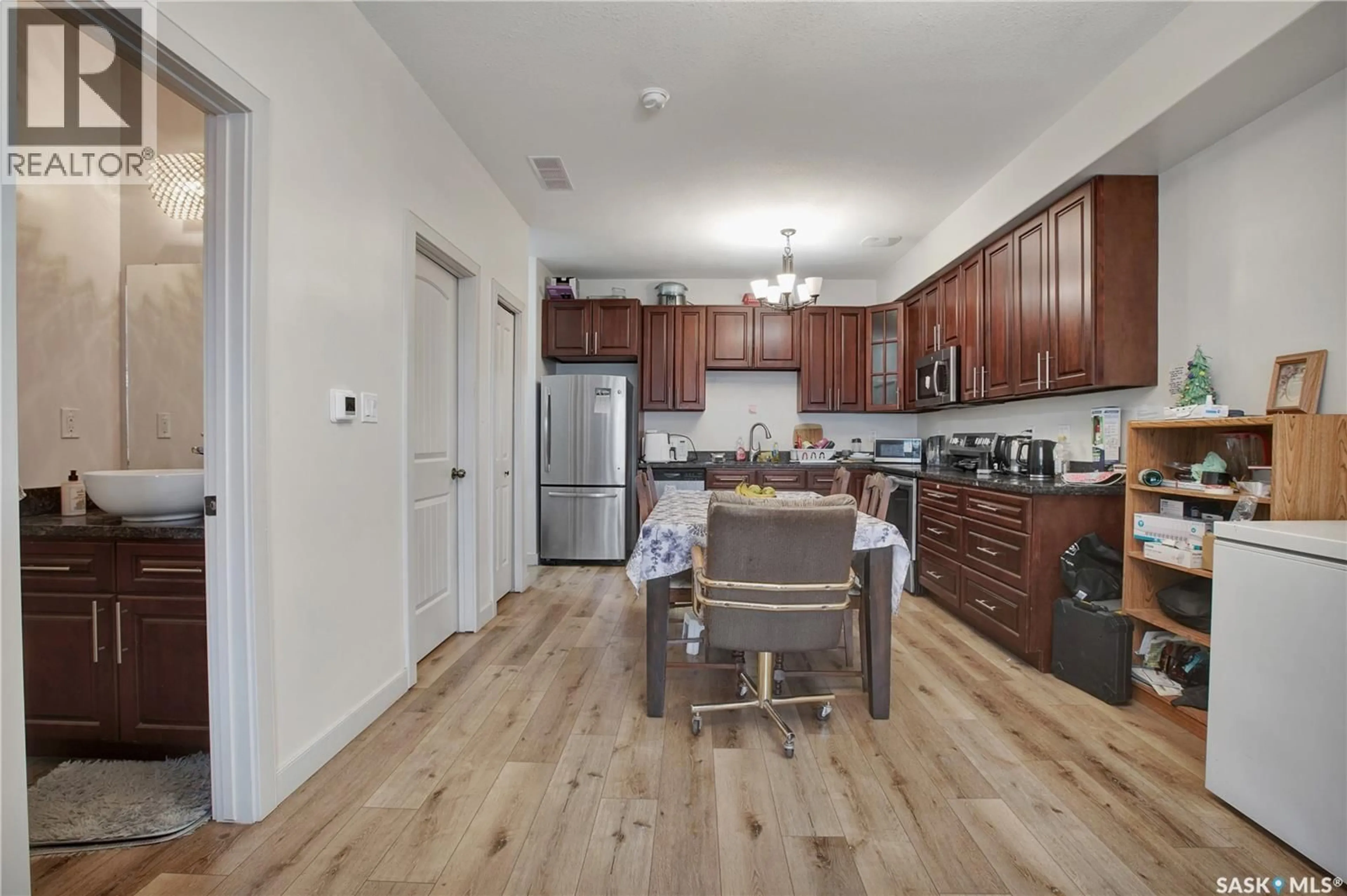 Open concept kitchen, wood/laminate floor for 48 - 1703 PATRICK CRESCENT, Saskatoon Saskatchewan S7W0L6