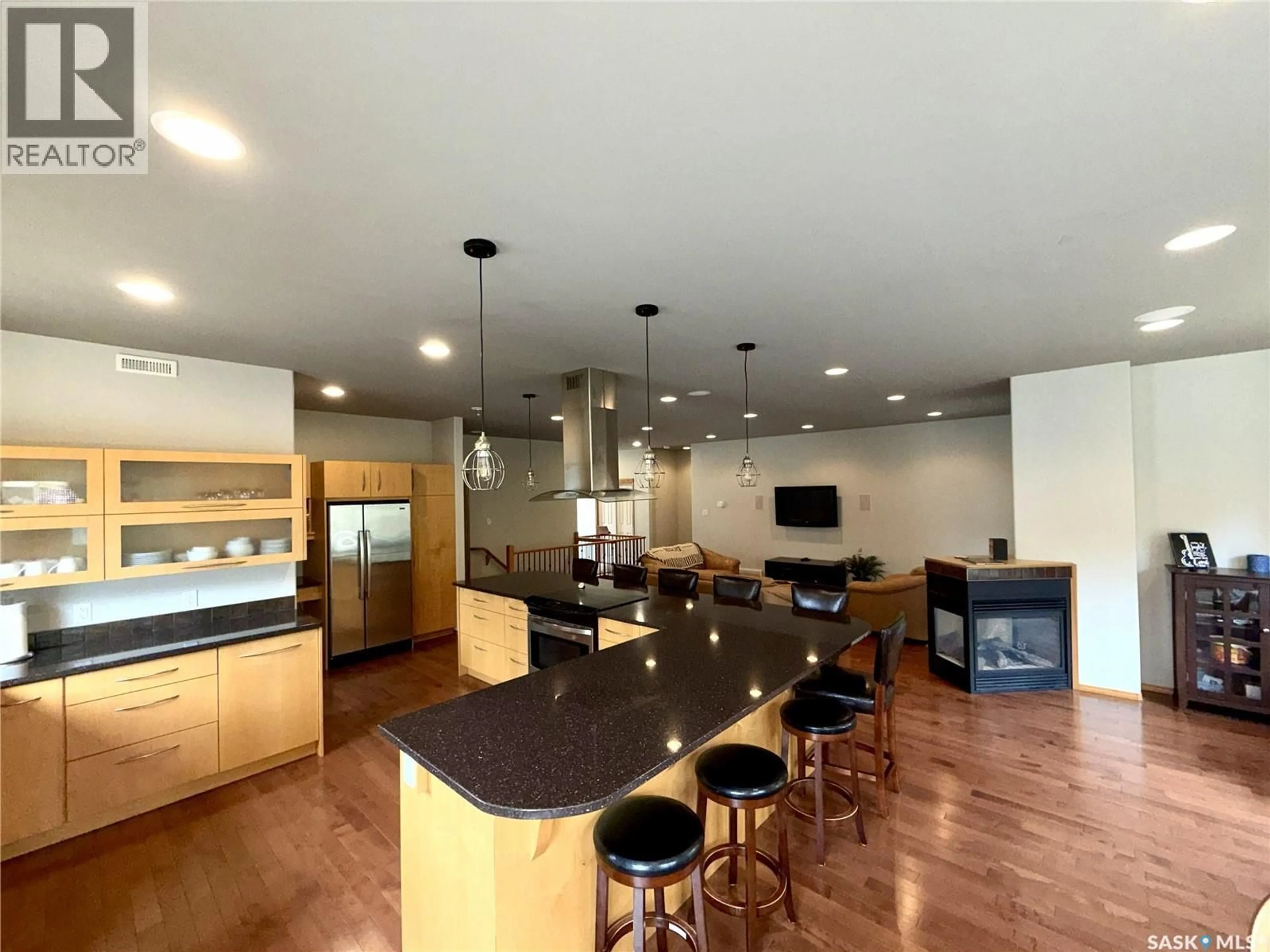 Open concept kitchen, wood/laminate floor for 57 ESTATES DRIVE, Elk Ridge Saskatchewan S0J0N0