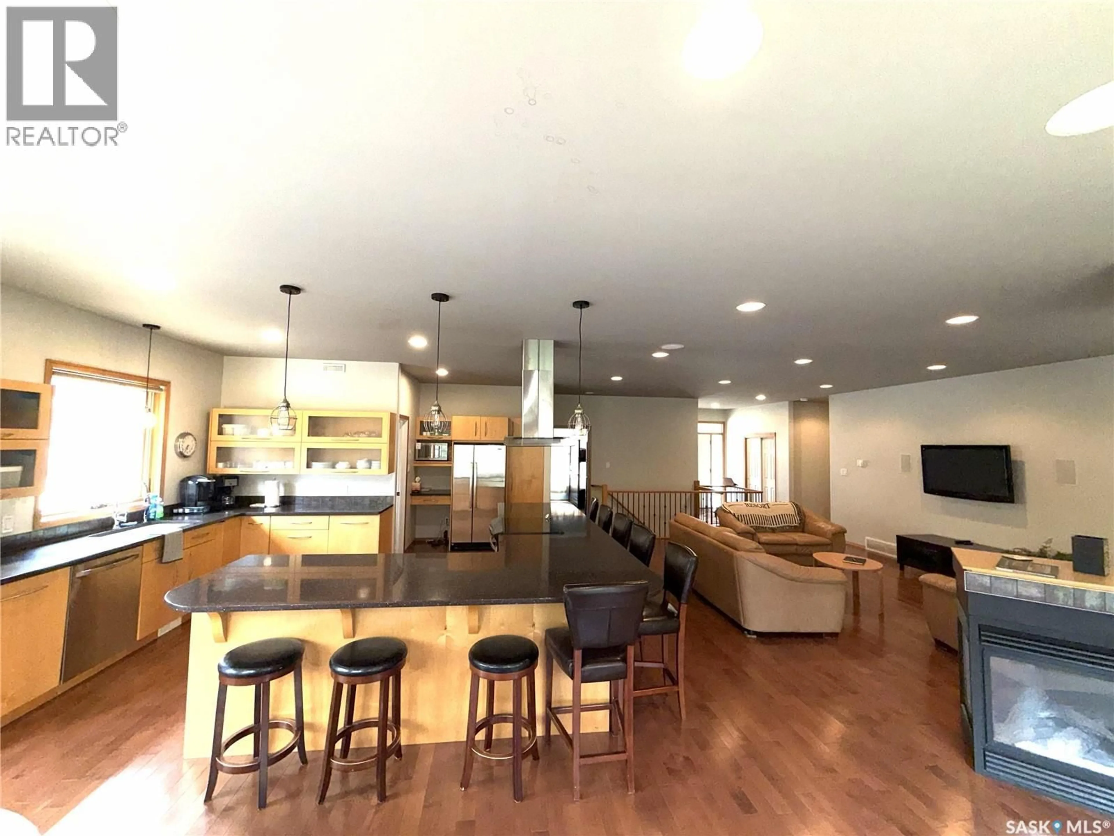 Open concept kitchen, wood/laminate floor for 57 ESTATES DRIVE, Elk Ridge Saskatchewan S0J0N0