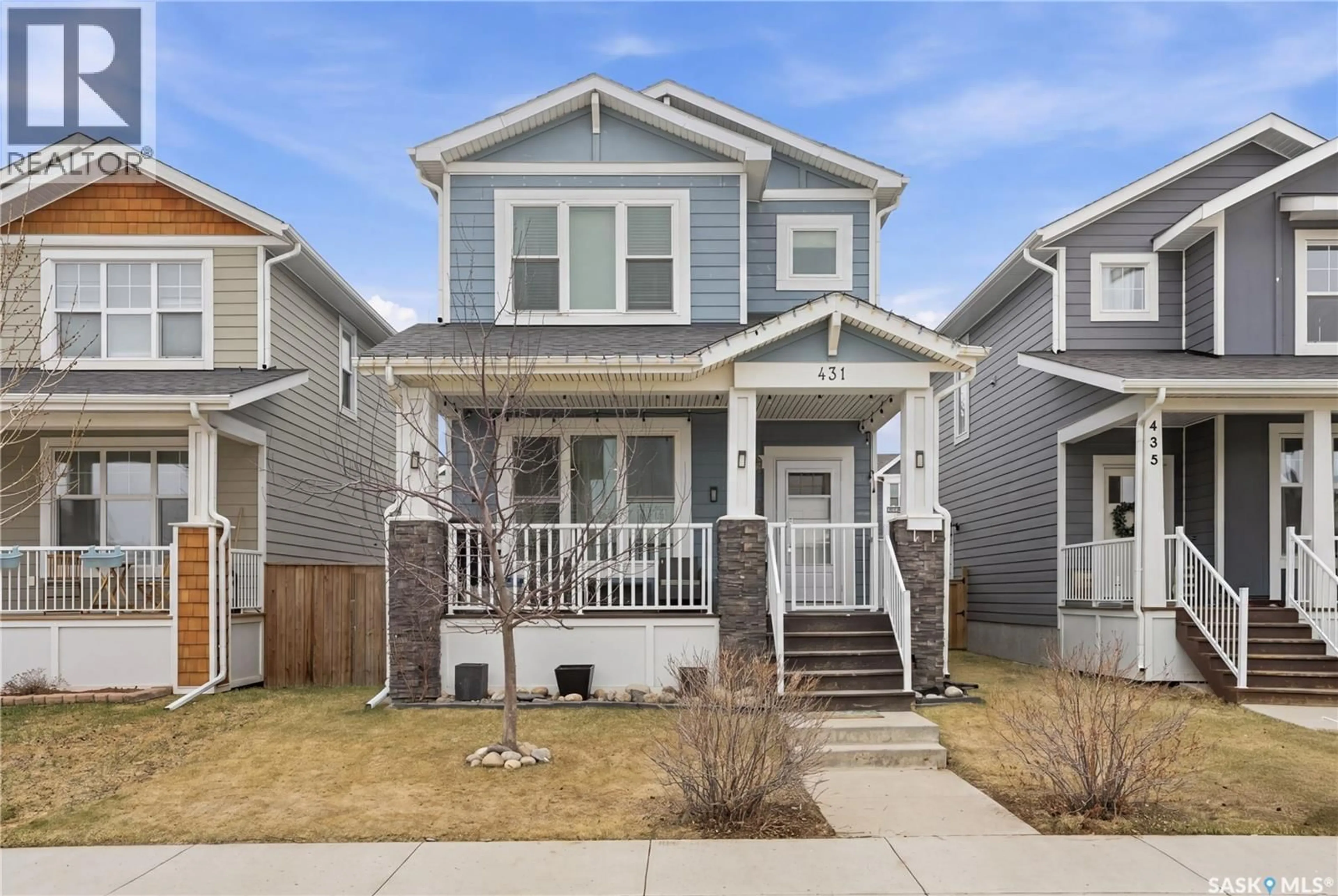 Home with vinyl exterior material, street for 431 EATON LANE, Saskatoon Saskatchewan S7V0H5
