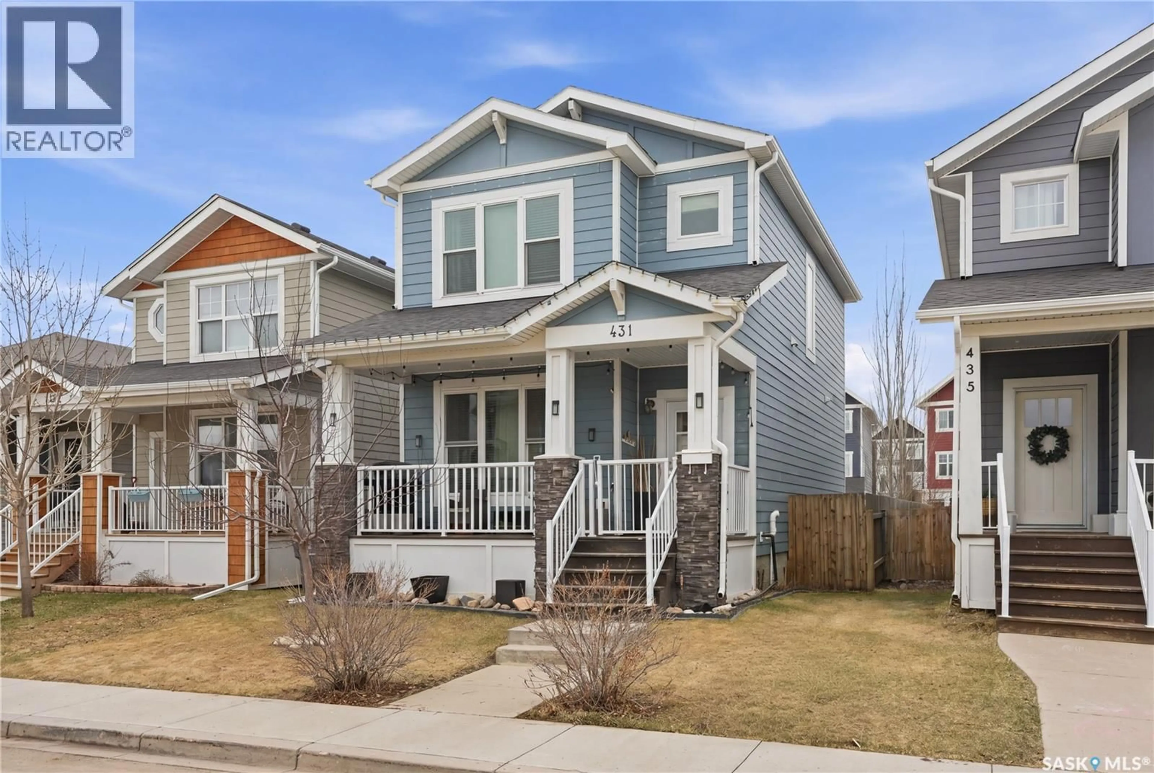 Home with vinyl exterior material, street for 431 EATON LANE, Saskatoon Saskatchewan S7V0H5