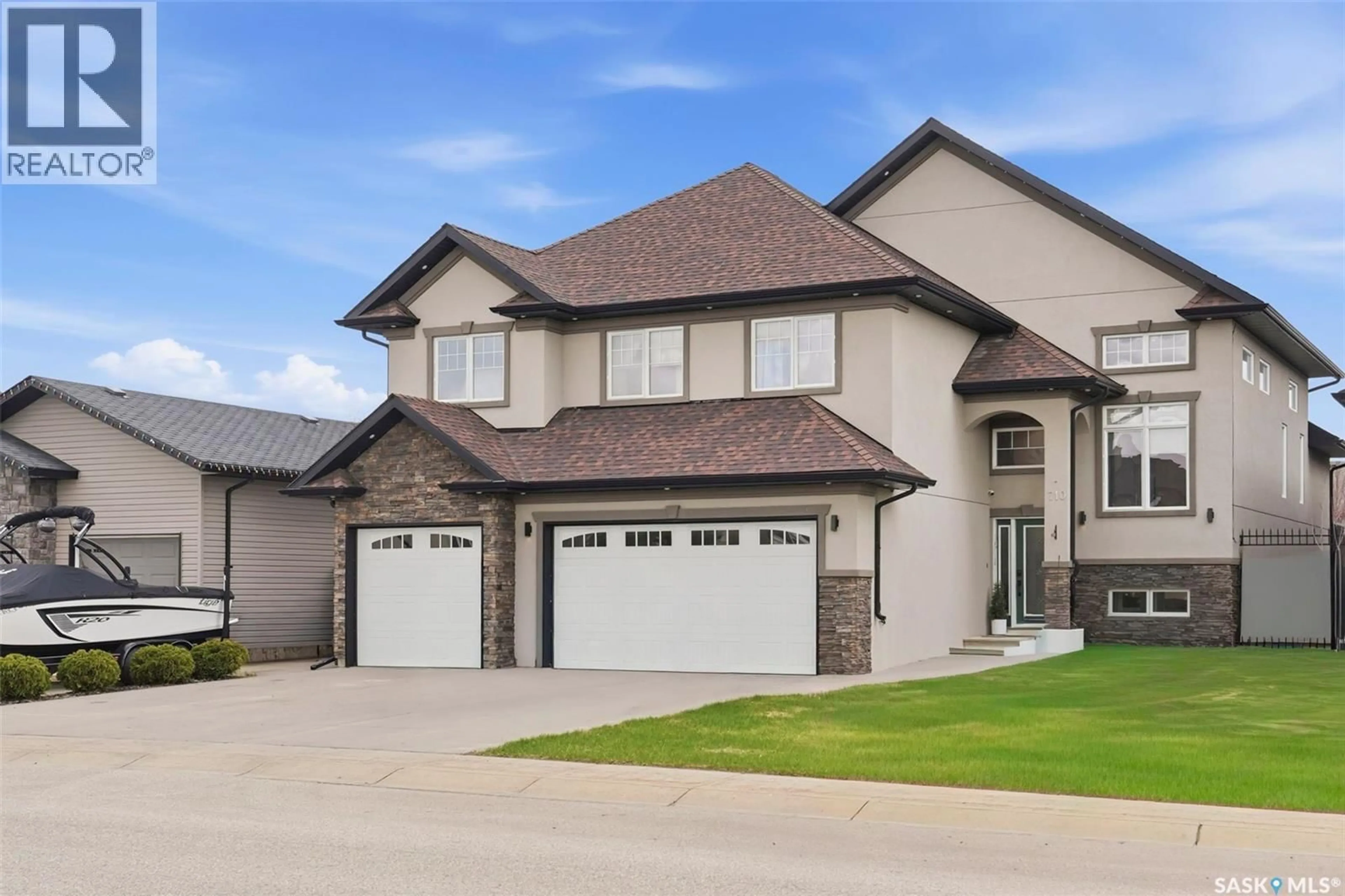 Home with vinyl exterior material, street for 710 CRYSTAL SPRINGS DRIVE, Warman Saskatchewan S0K4S2