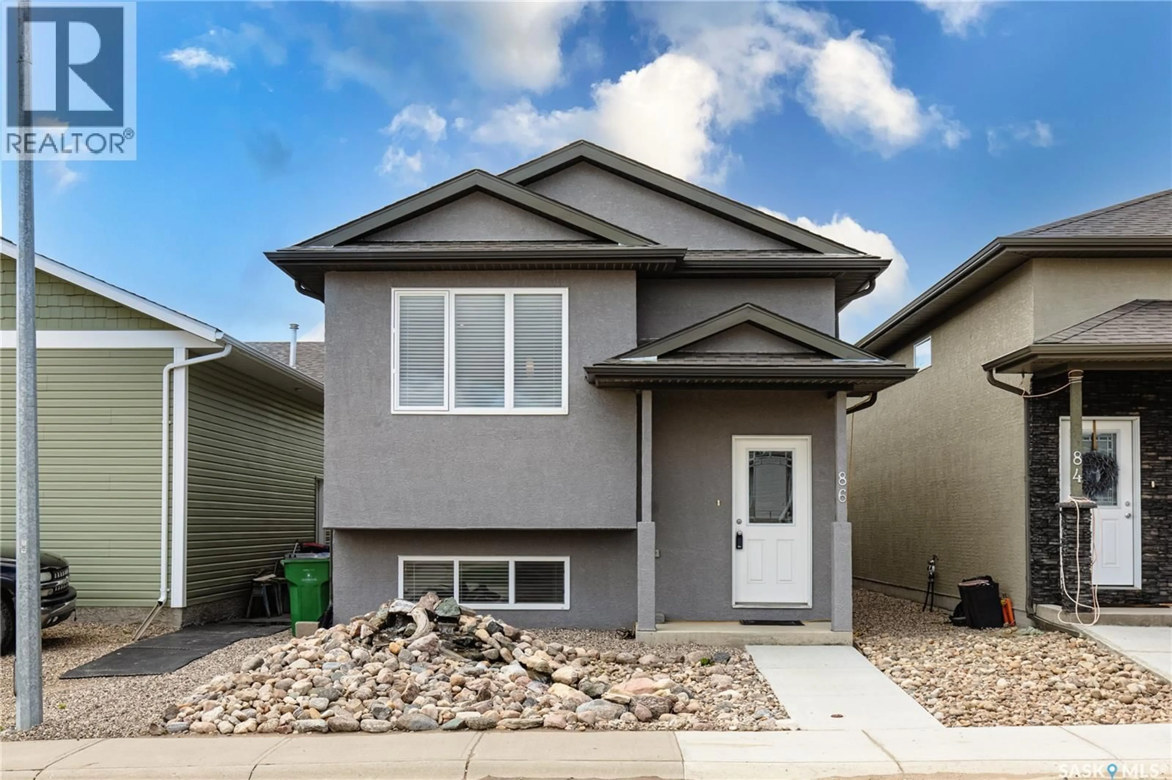 Home with vinyl exterior material, street for 86 BRIGHAM ROAD, Moose Jaw Saskatchewan S6K0A7