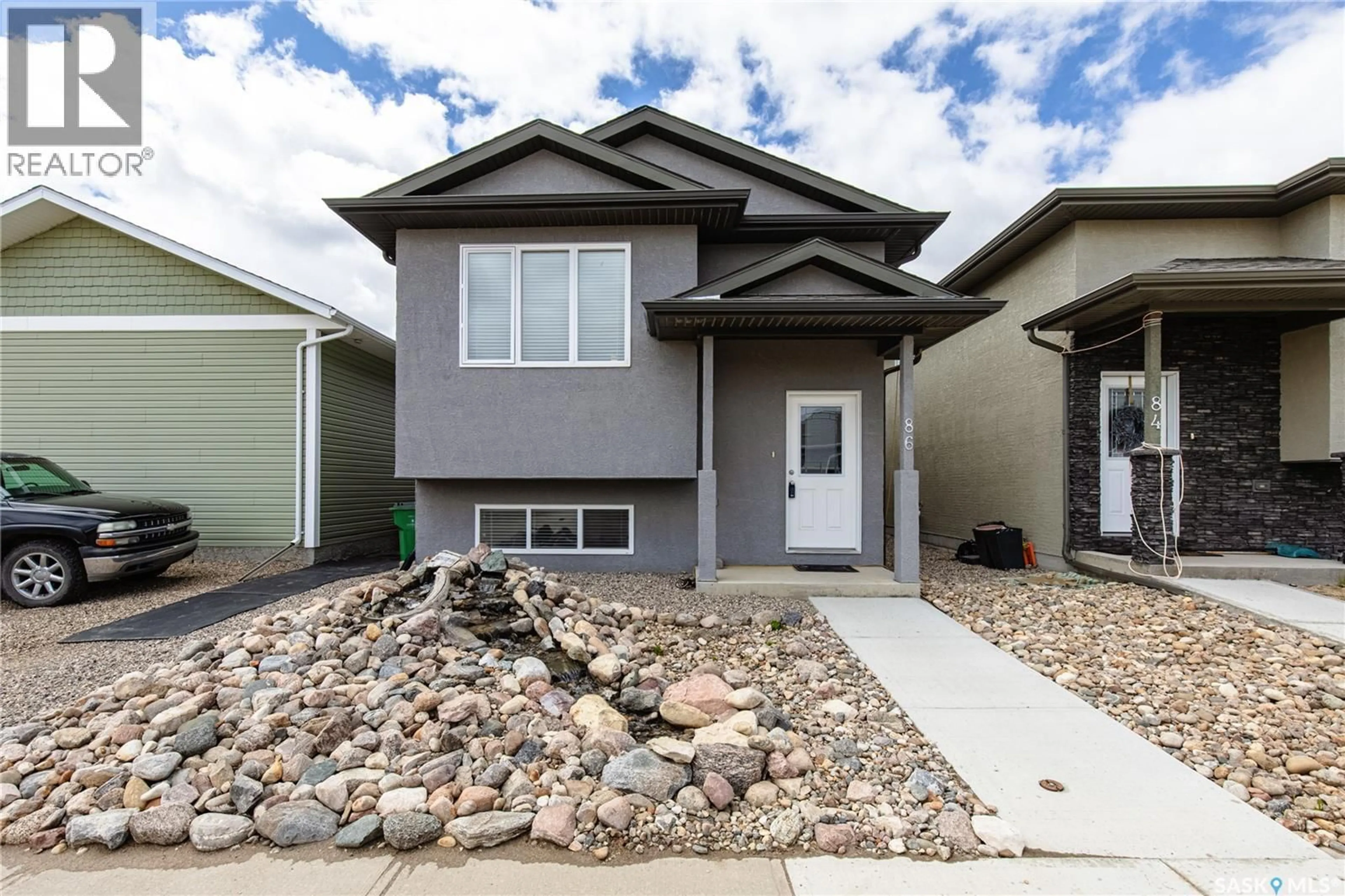 Home with vinyl exterior material, street for 86 BRIGHAM ROAD, Moose Jaw Saskatchewan S6K0A7