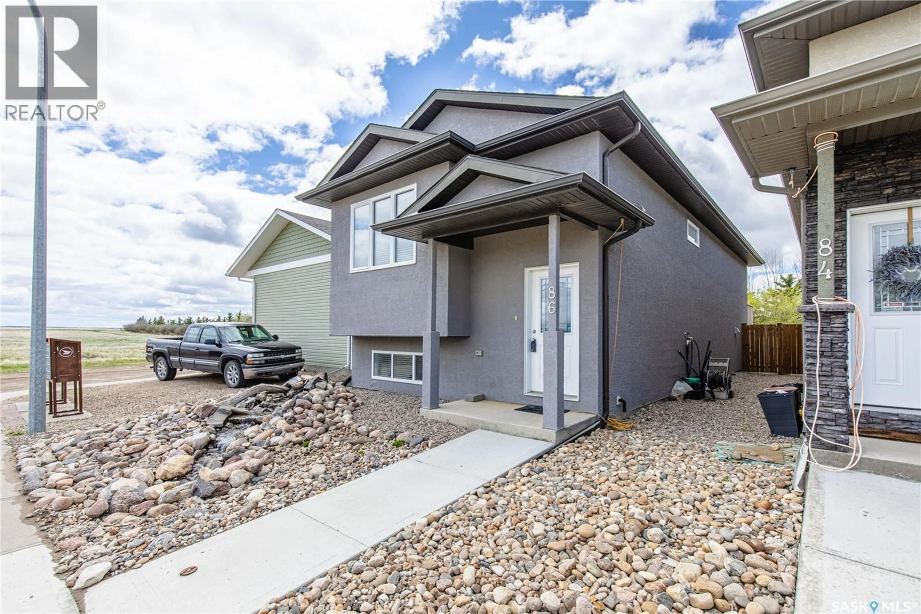 Home with vinyl exterior material, street for 86 BRIGHAM ROAD, Moose Jaw Saskatchewan S6K0A7