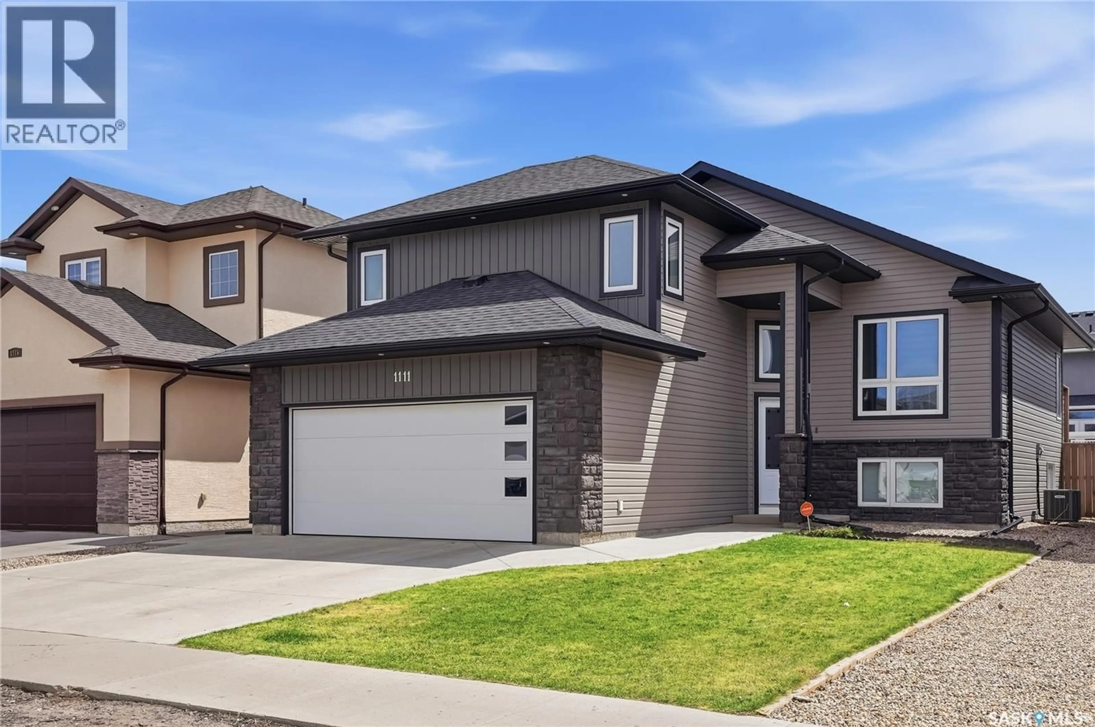 Home with vinyl exterior material, street for 1111 EVERGREEN BOULEVARD, Saskatoon Saskatchewan S7W0R5