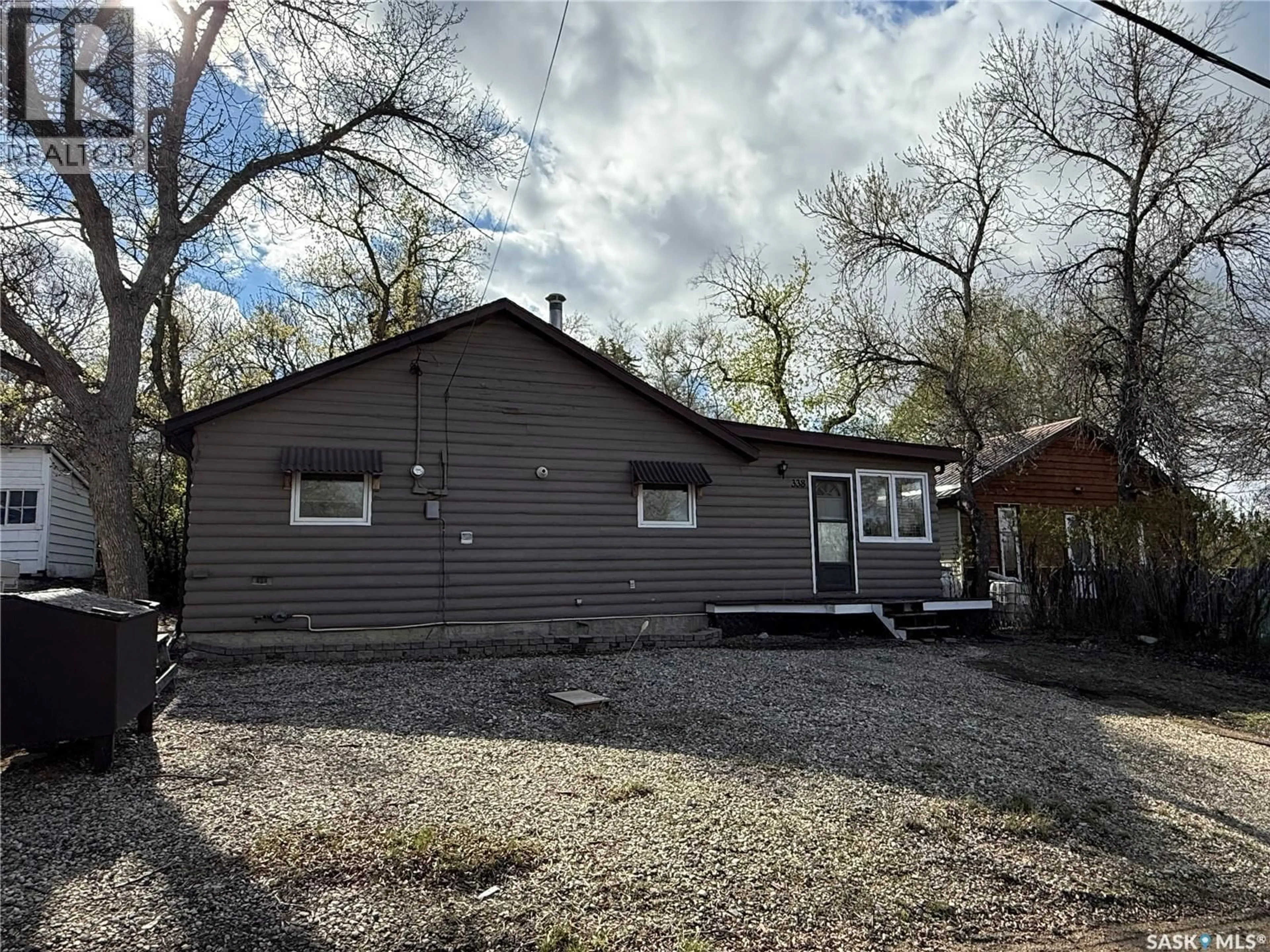 Home with vinyl exterior material, street for 338 3RD STREET, Regina Beach Saskatchewan S0G4C0