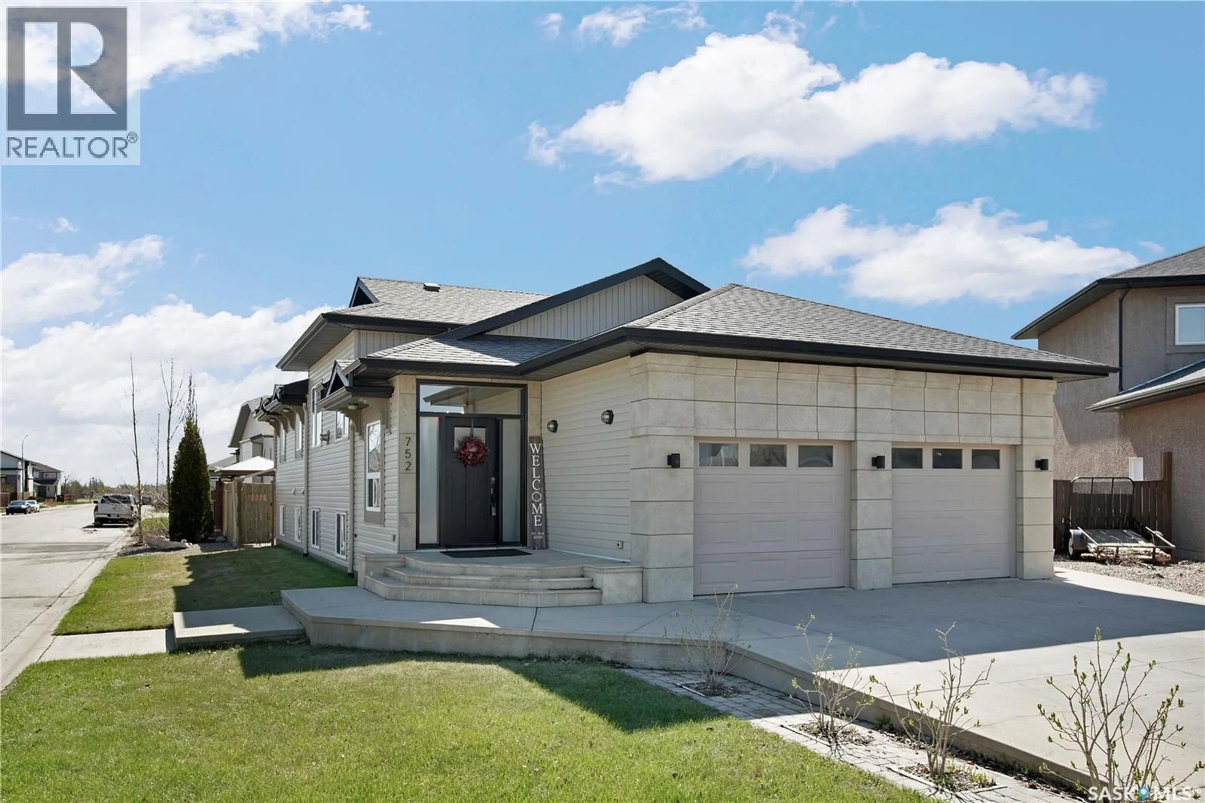 Home with vinyl exterior material, street for 752 REDDEKOPP DRIVE, Martensville Saskatchewan S0K2T2