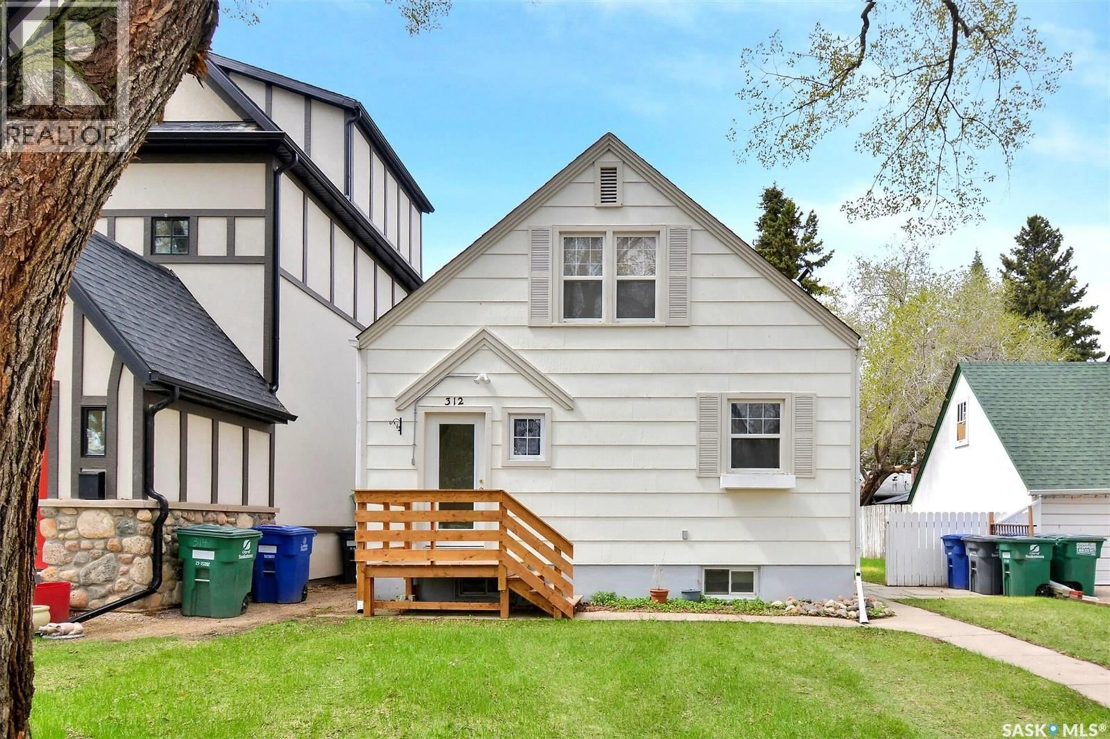 Home with vinyl exterior material, street for 312 MCKINNON AVENUE, Saskatoon Saskatchewan S7N1J6