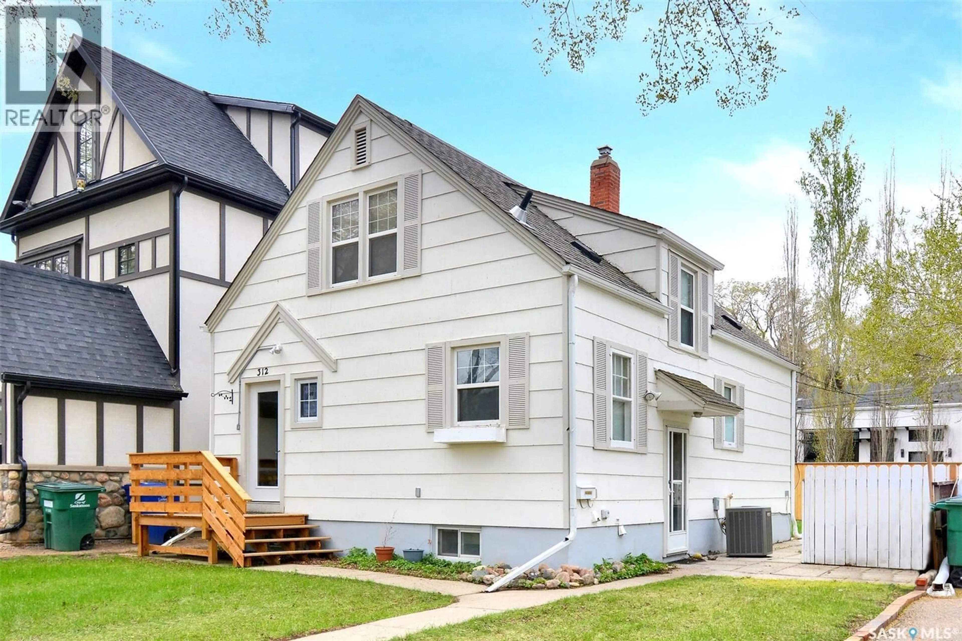 Home with vinyl exterior material, street for 312 MCKINNON AVENUE, Saskatoon Saskatchewan S7N1J6