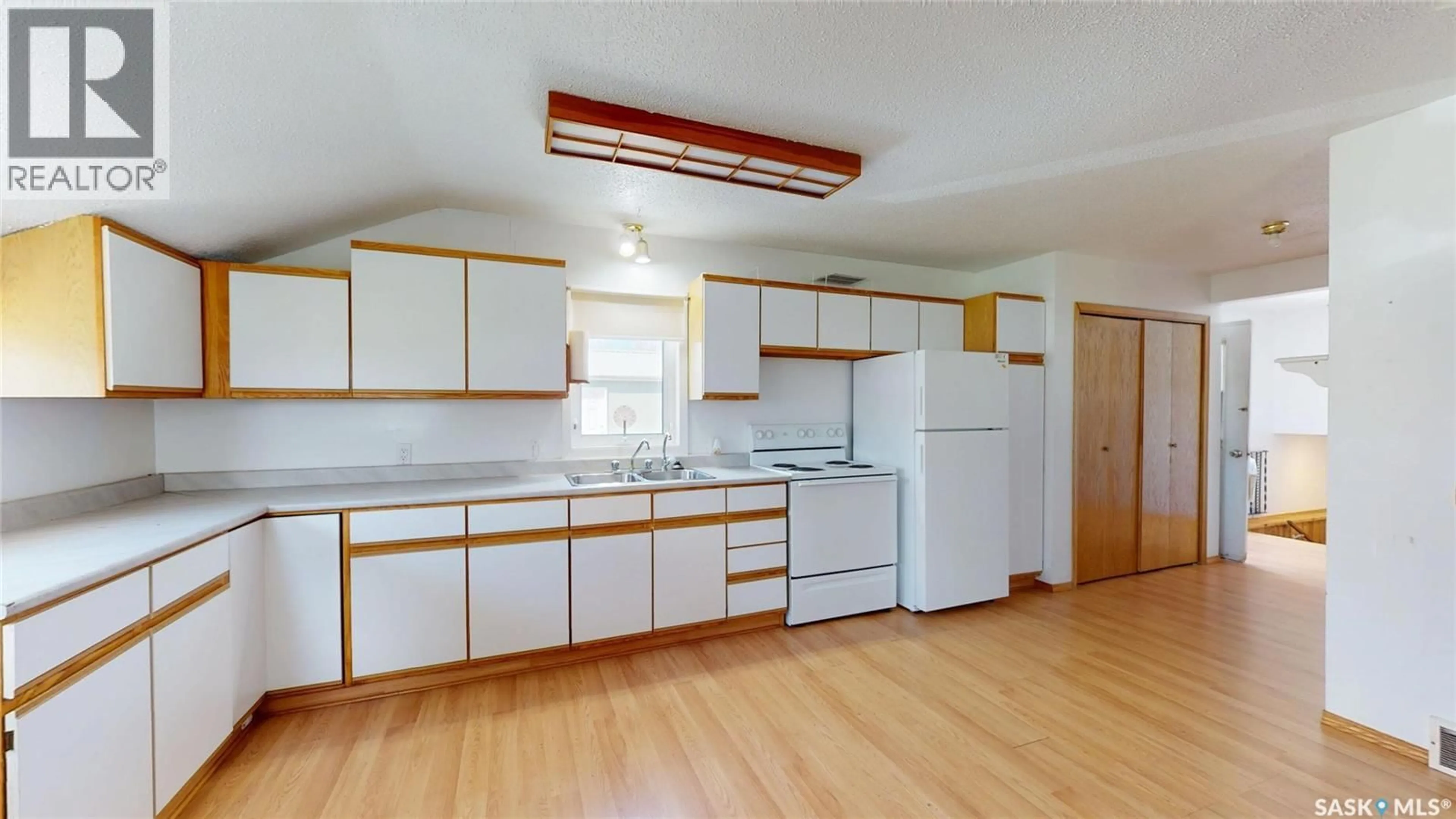 Standard kitchen, wood/laminate floor for 105 PIPESTONE AVENUE, Wawota Saskatchewan S0G5A0
