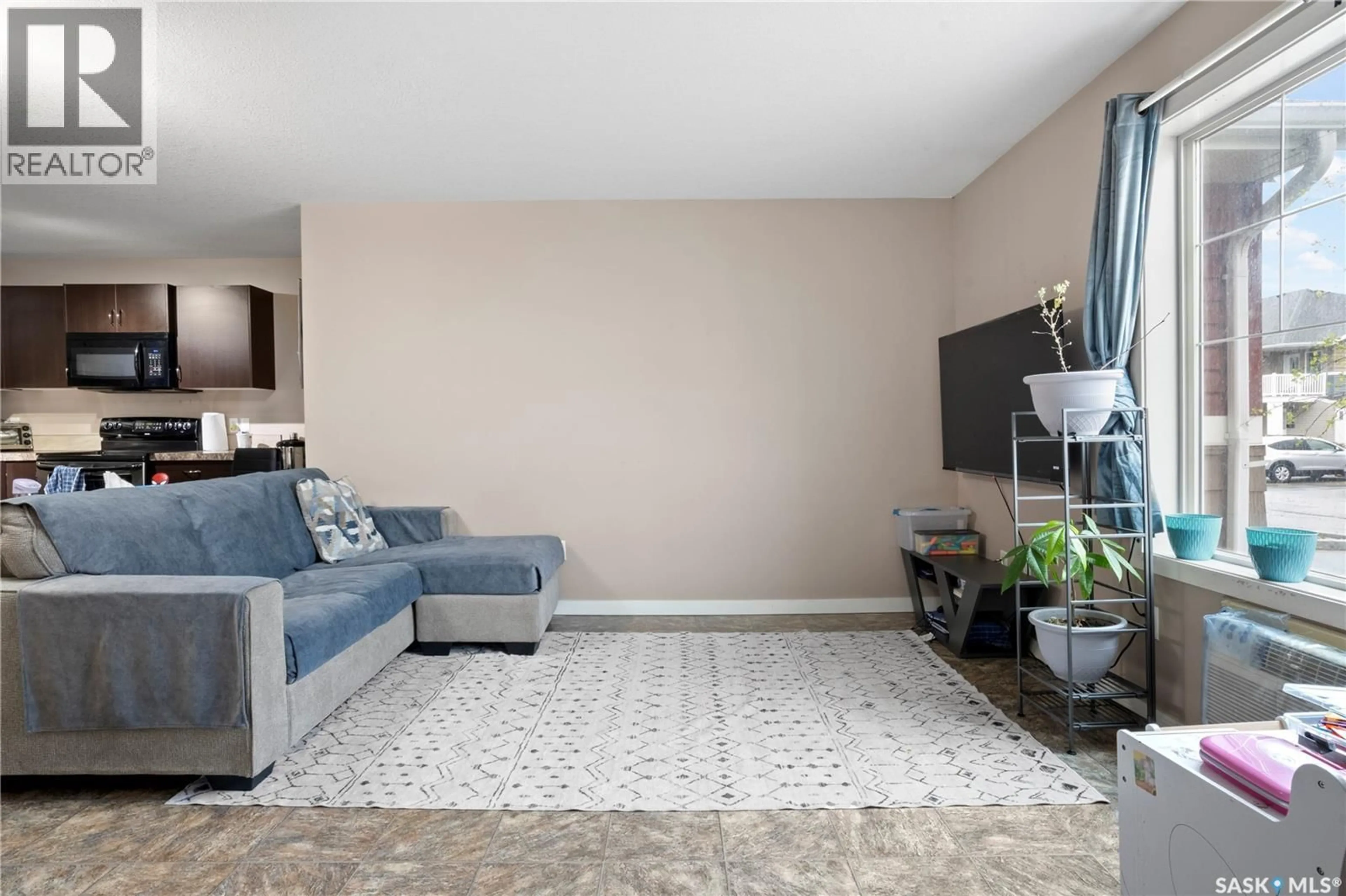 Living room with furniture, carpet floor for 82 - 5622 GORDON ROAD, Regina Saskatchewan S4W0M1