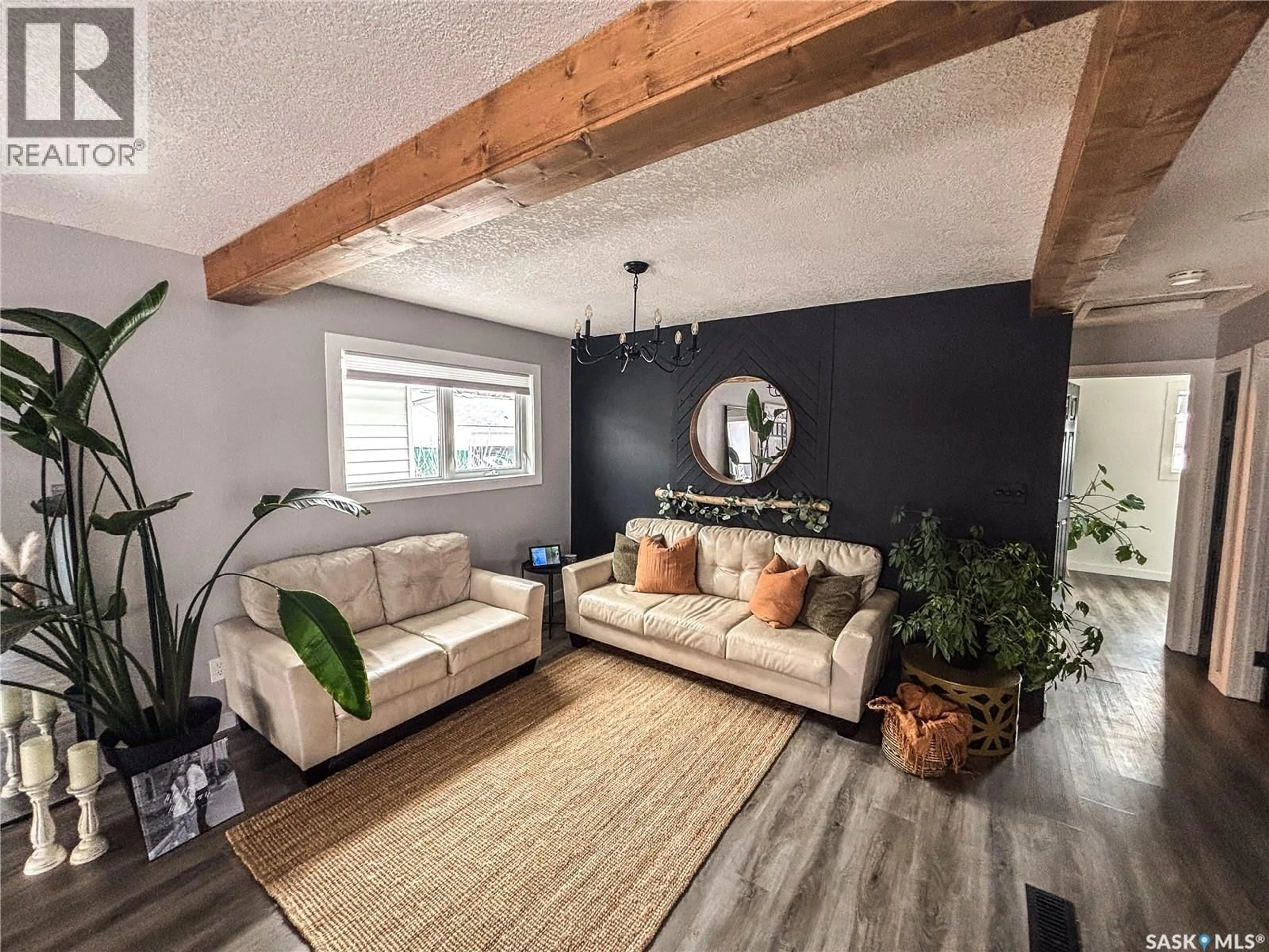 Living room with furniture, wood/laminate floor for 812 QU'APPELLE STREET, Grenfell Saskatchewan S0G2B0