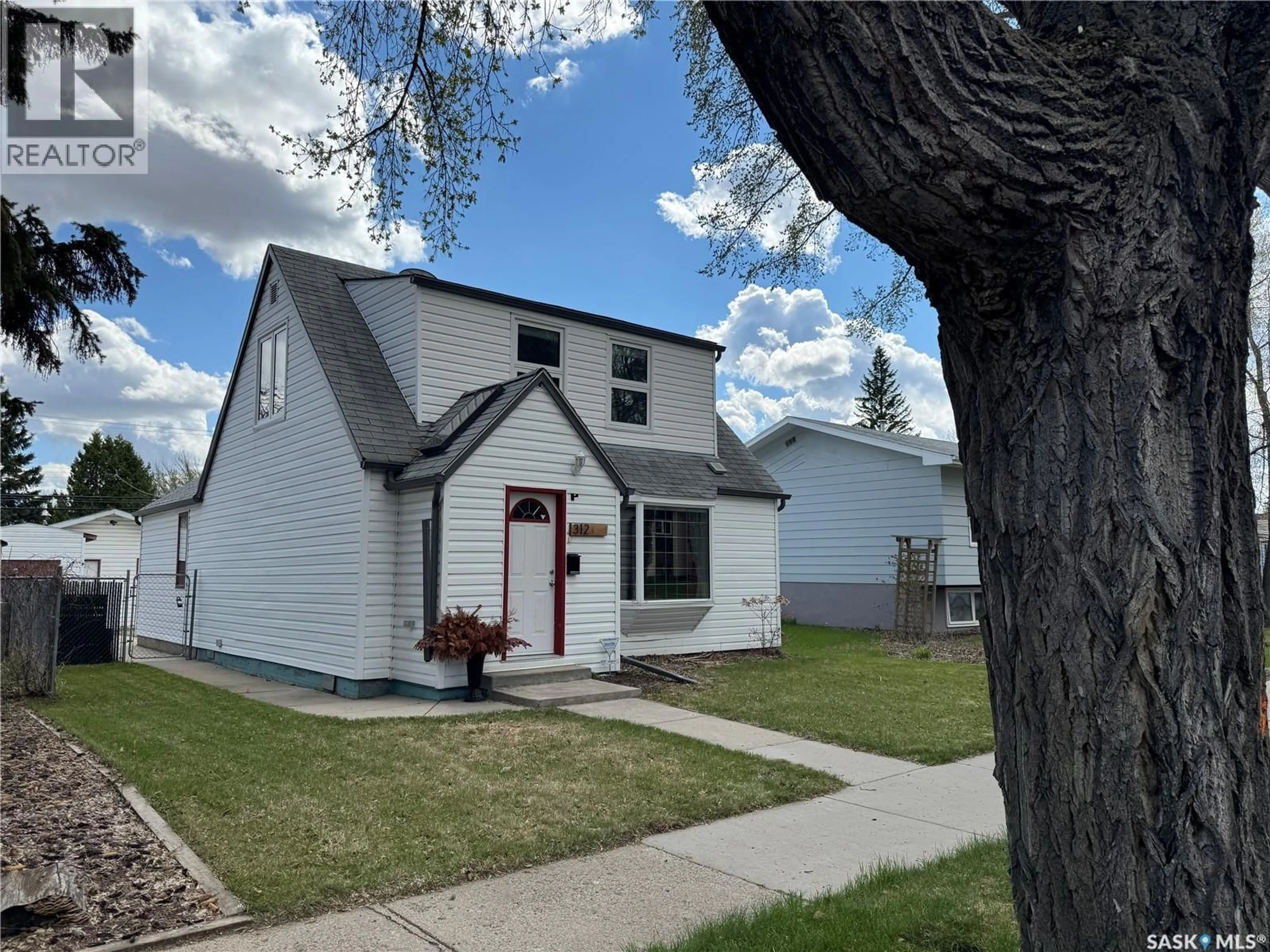 Home with vinyl exterior material, street for 312 1ST STREET, Saskatoon Saskatchewan S7H1S2