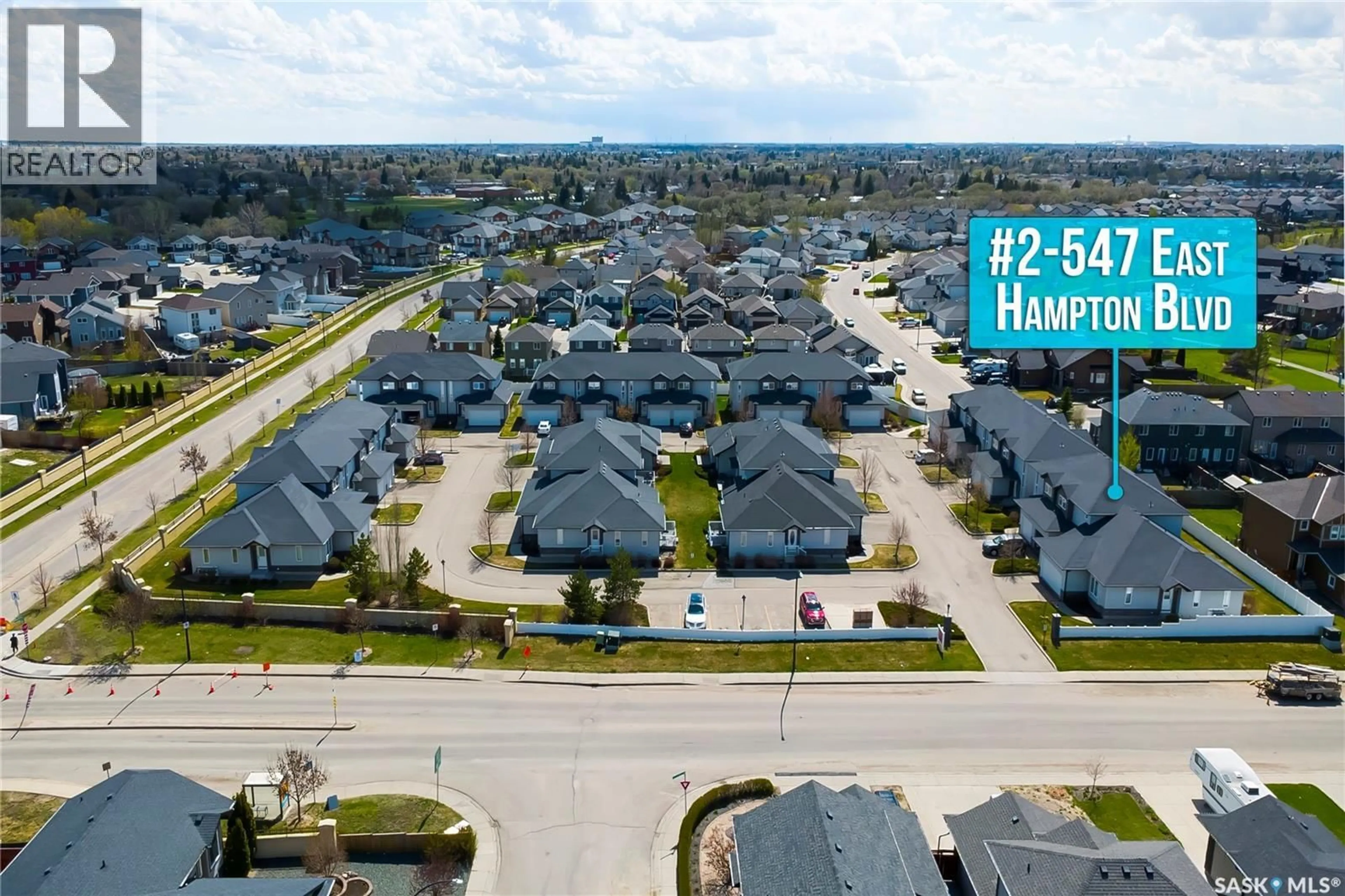 A pic from outside/outdoor area/front of a property/back of a property/a pic from drone, street for 2 547 EAST HAMPTON BOULEVARD, Saskatoon Saskatchewan S7R0B1