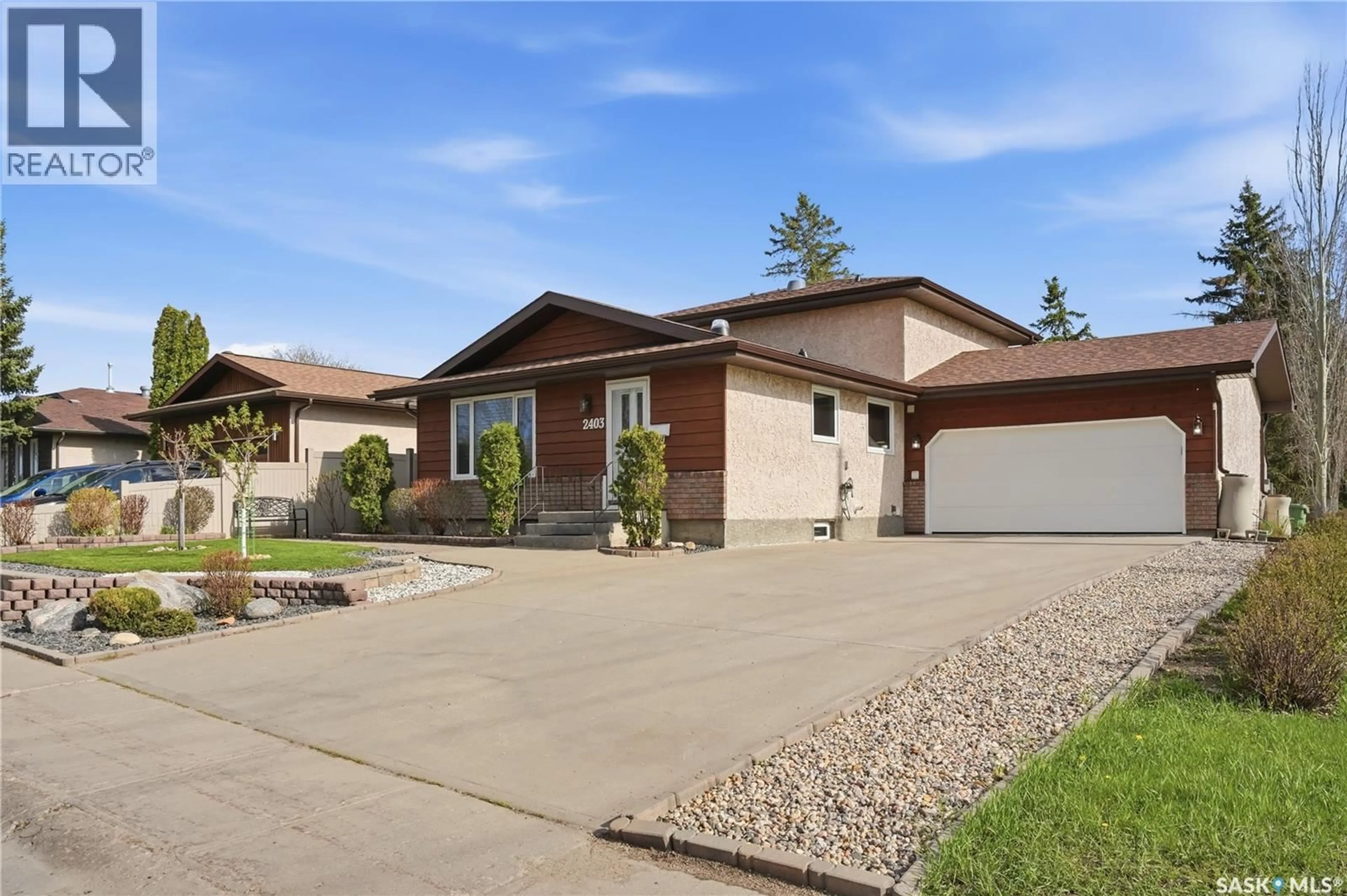 Home with brick exterior material, street for 2403 TRUESDALE DRIVE, Regina Saskatchewan S4V0W1
