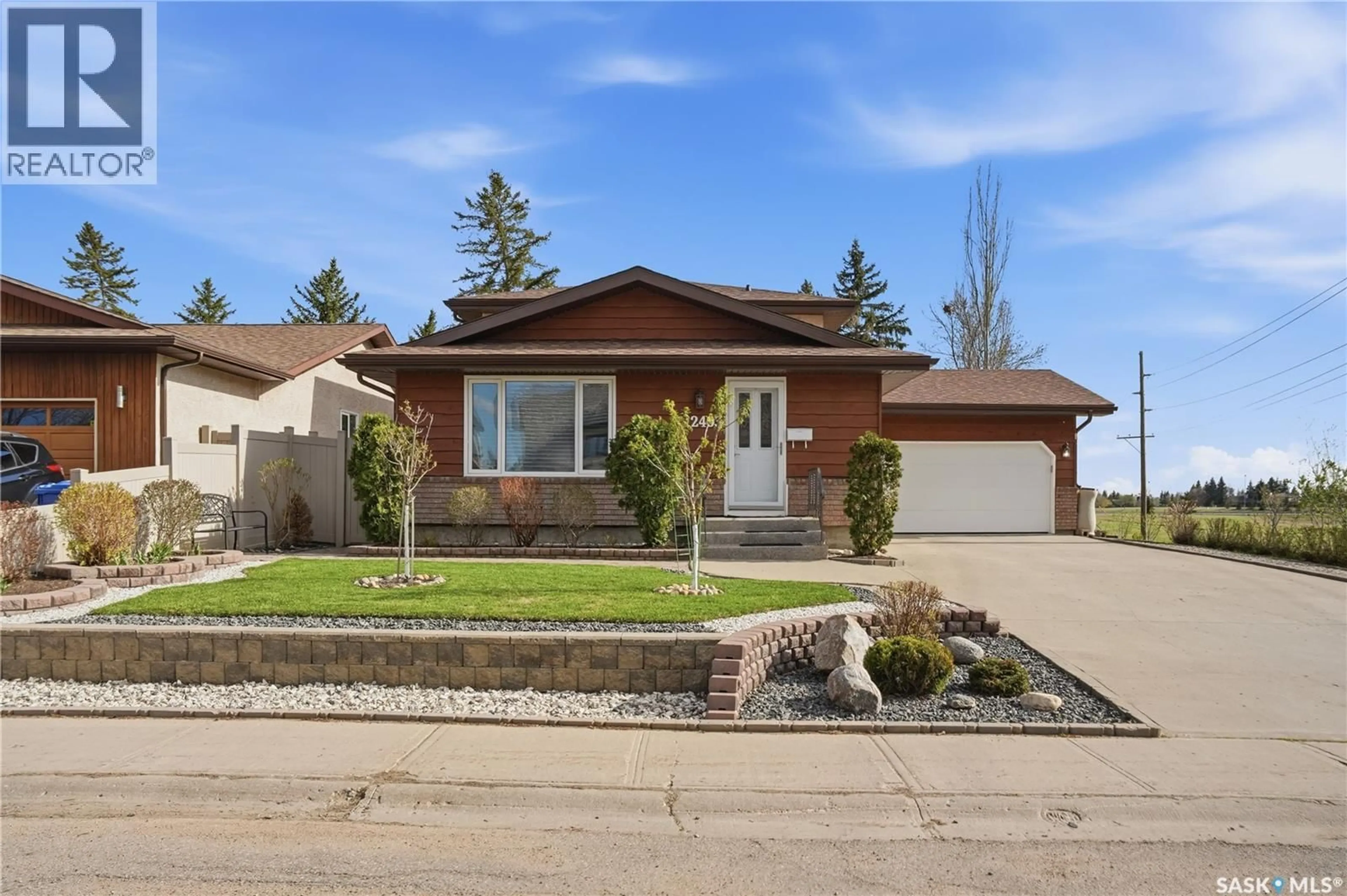 Home with brick exterior material, street for 2403 TRUESDALE DRIVE, Regina Saskatchewan S4V0W1