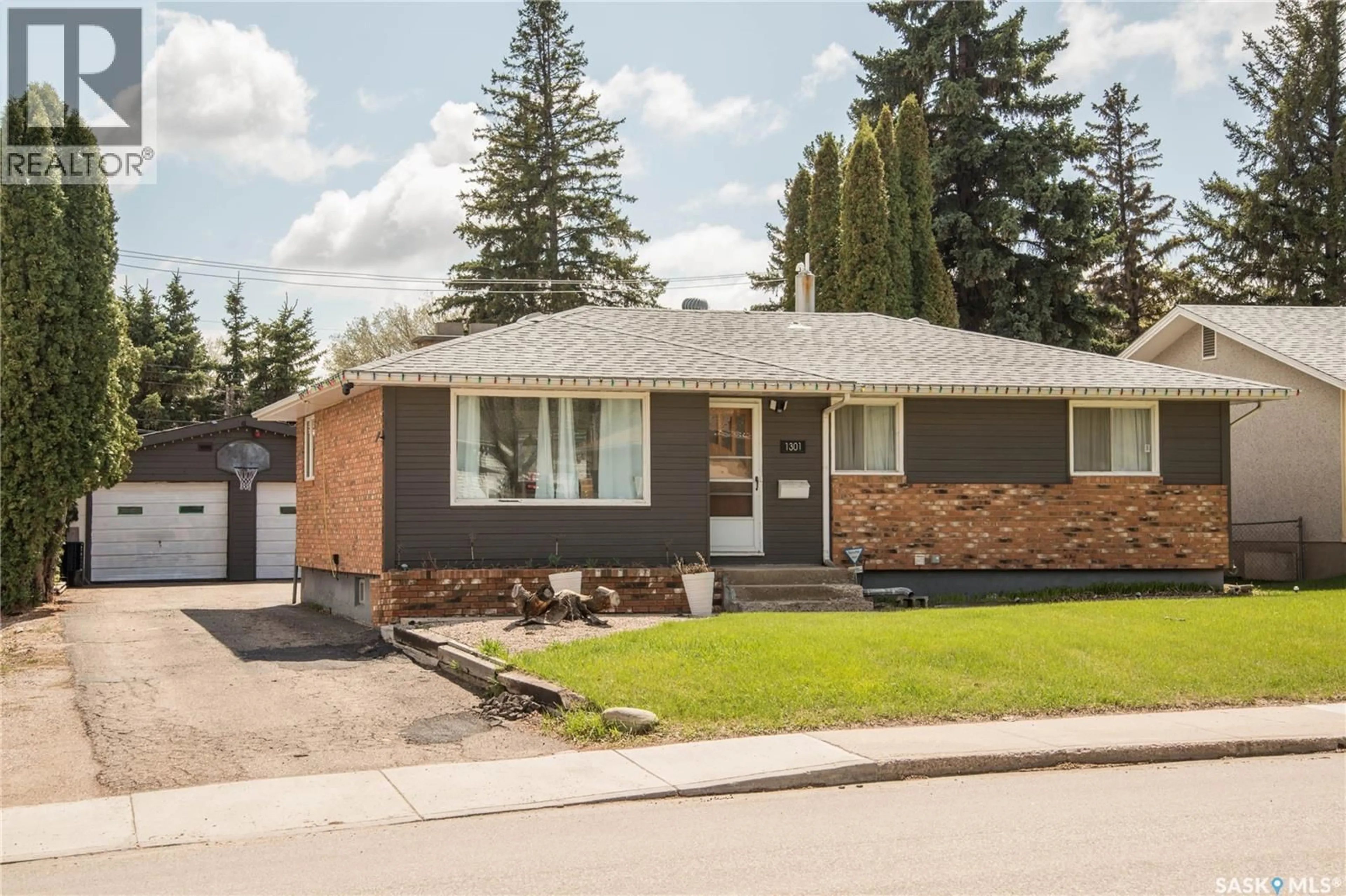 Home with brick exterior material, street for 1301 33RD STREET, Saskatoon Saskatchewan S7L0X1
