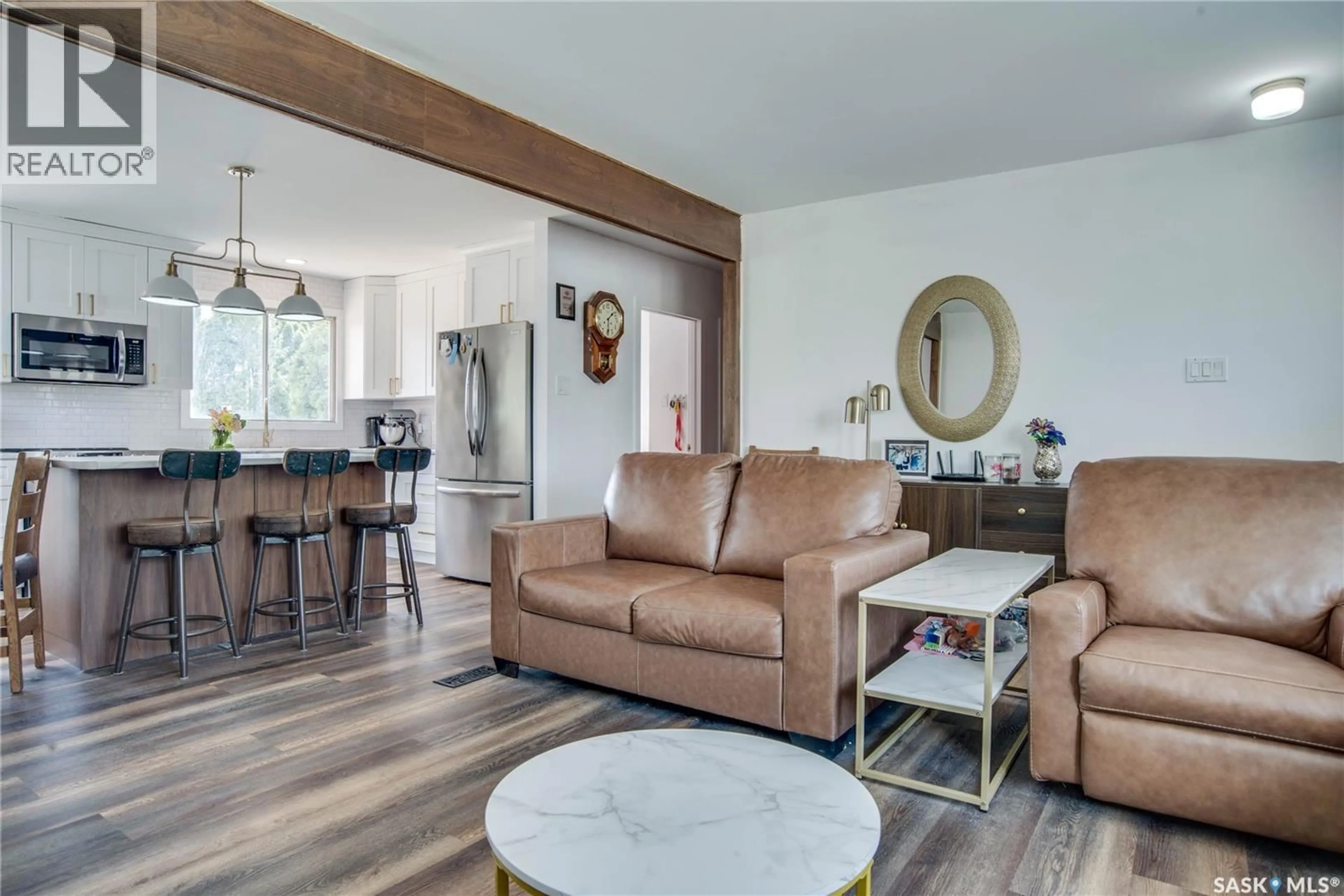 Living room with furniture, wood/laminate floor for 1301 33RD STREET, Saskatoon Saskatchewan S7L0X1