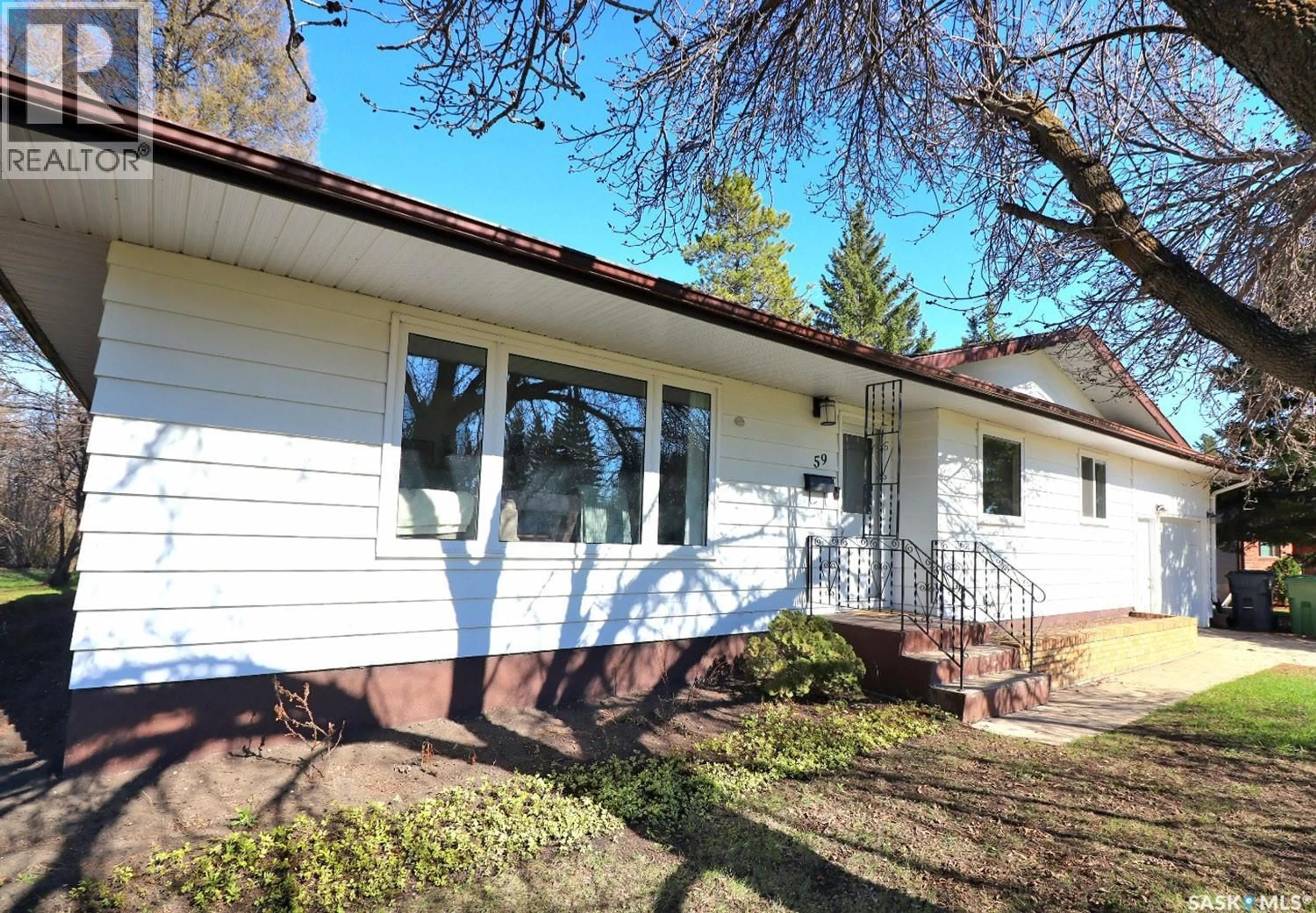 Home with vinyl exterior material, street for 59 ALEXANDRA AVENUE, Yorkton Saskatchewan S3N2J6