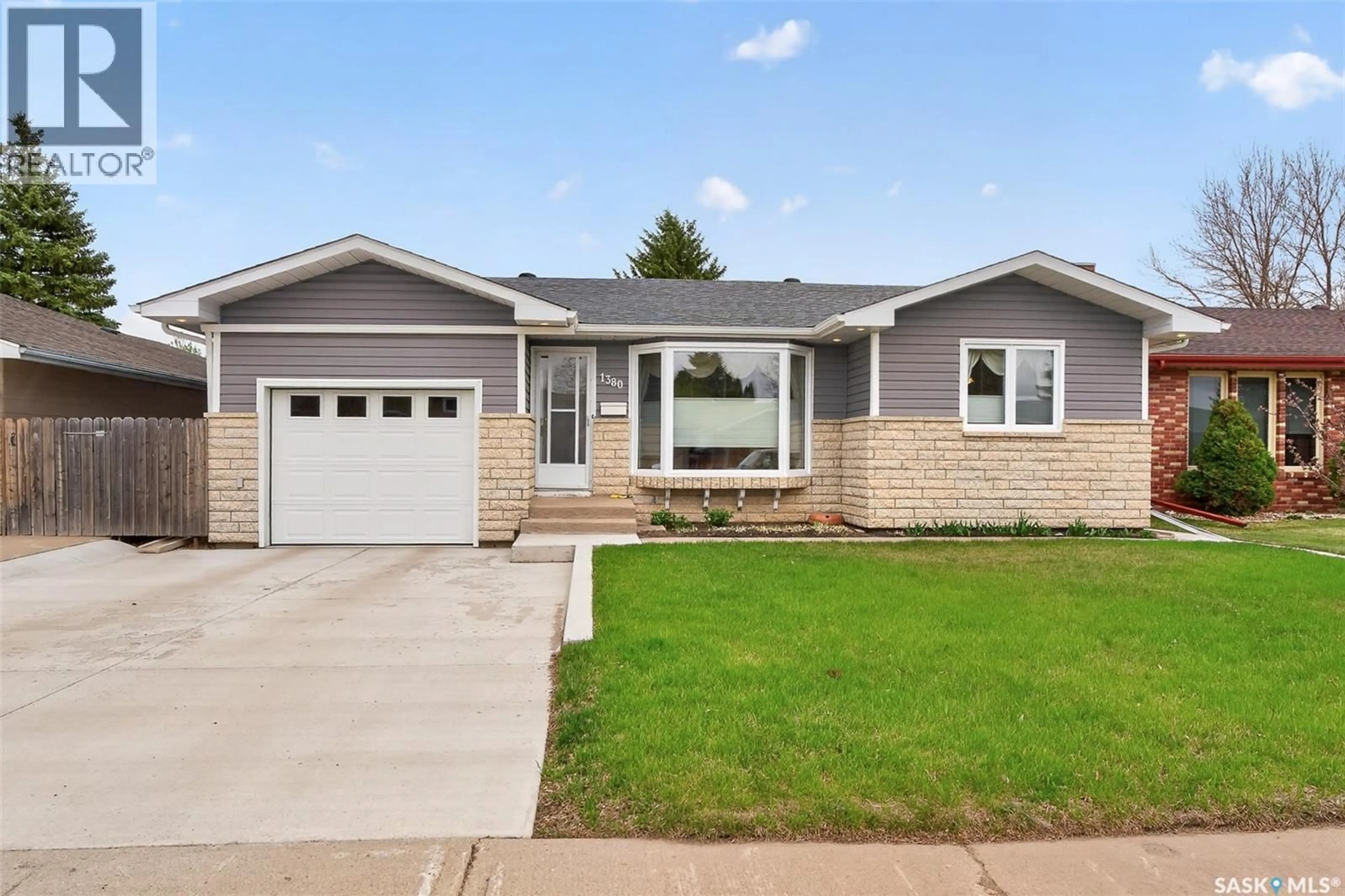 Home with vinyl exterior material, street for 1380 REGAL CRESCENT, Moose Jaw Saskatchewan S6H7S2