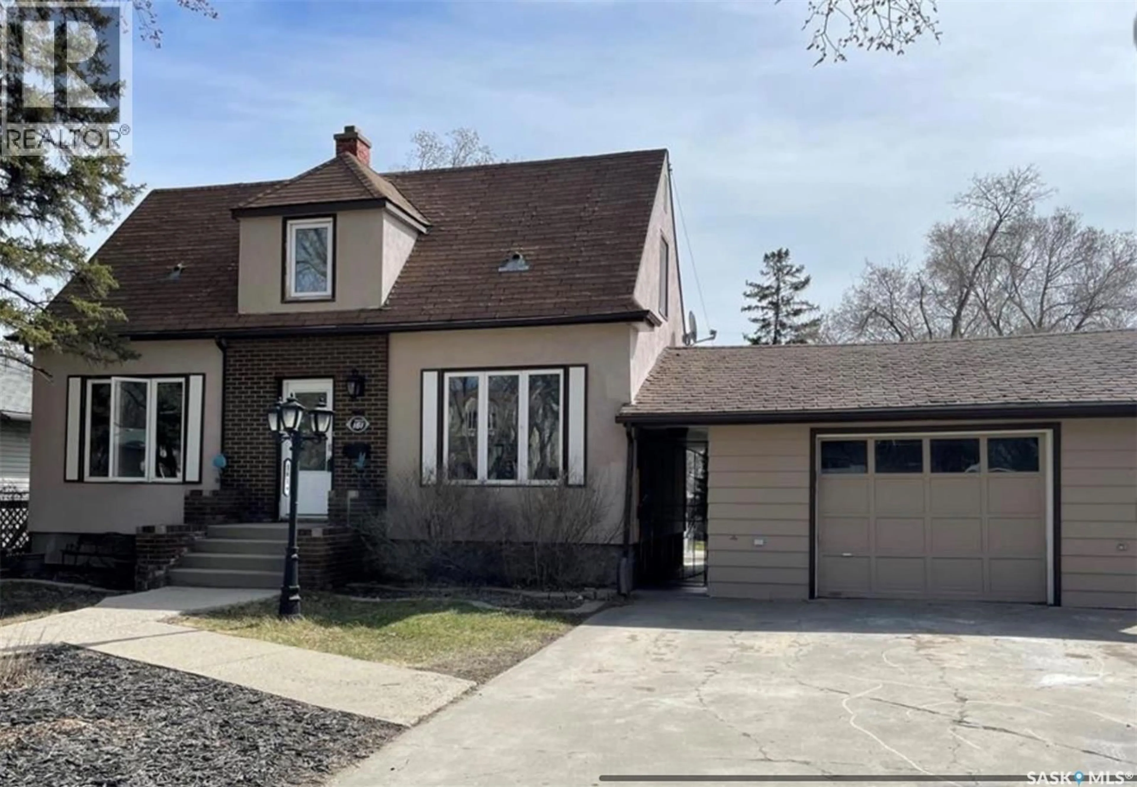 Home with vinyl exterior material, street for 161 HALIFAX STREET, Regina Saskatchewan S4R2W5