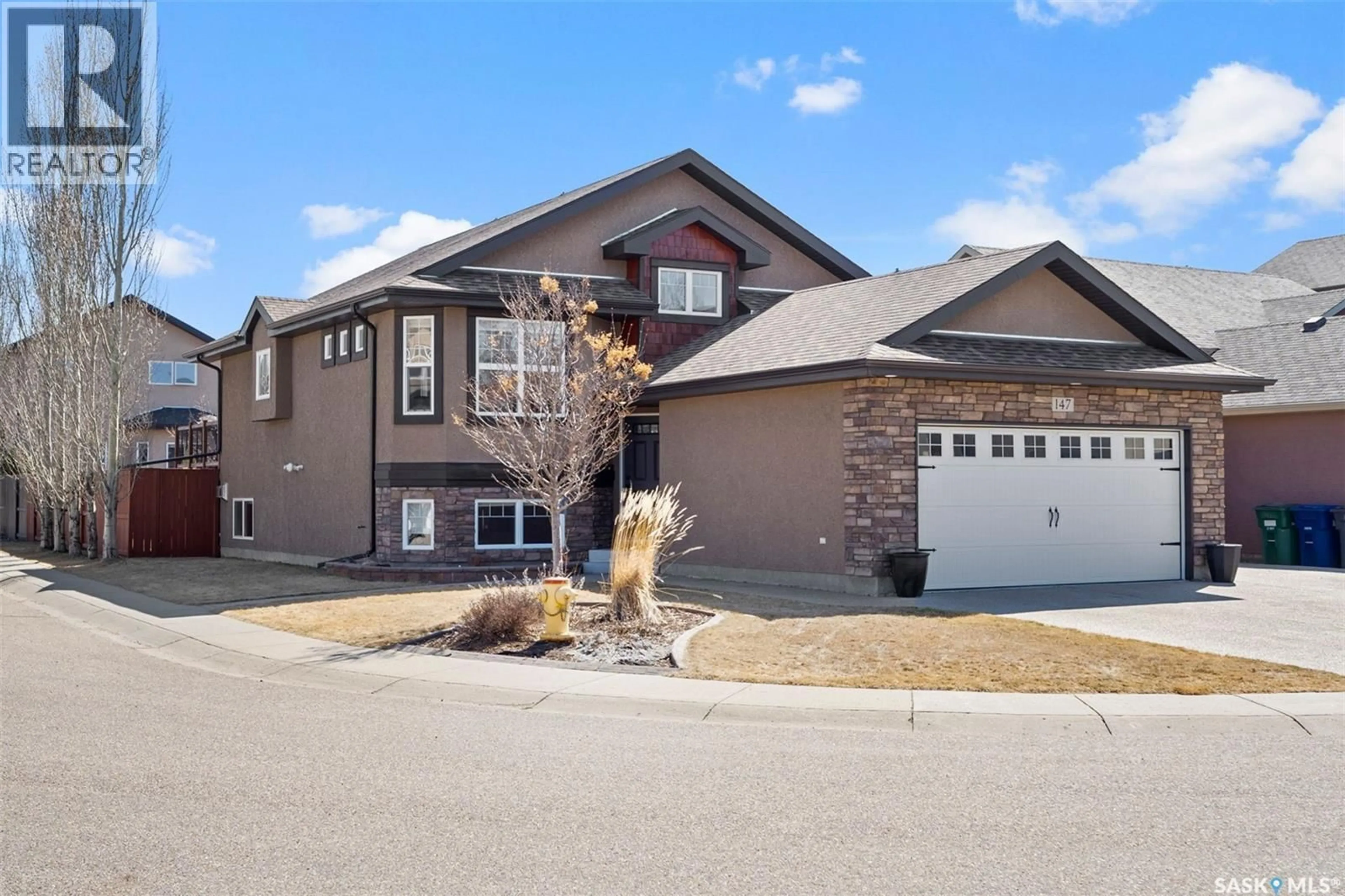 Home with vinyl exterior material, street for 147 BLACKSTOCK COVE, Saskatoon Saskatchewan S7T0H4