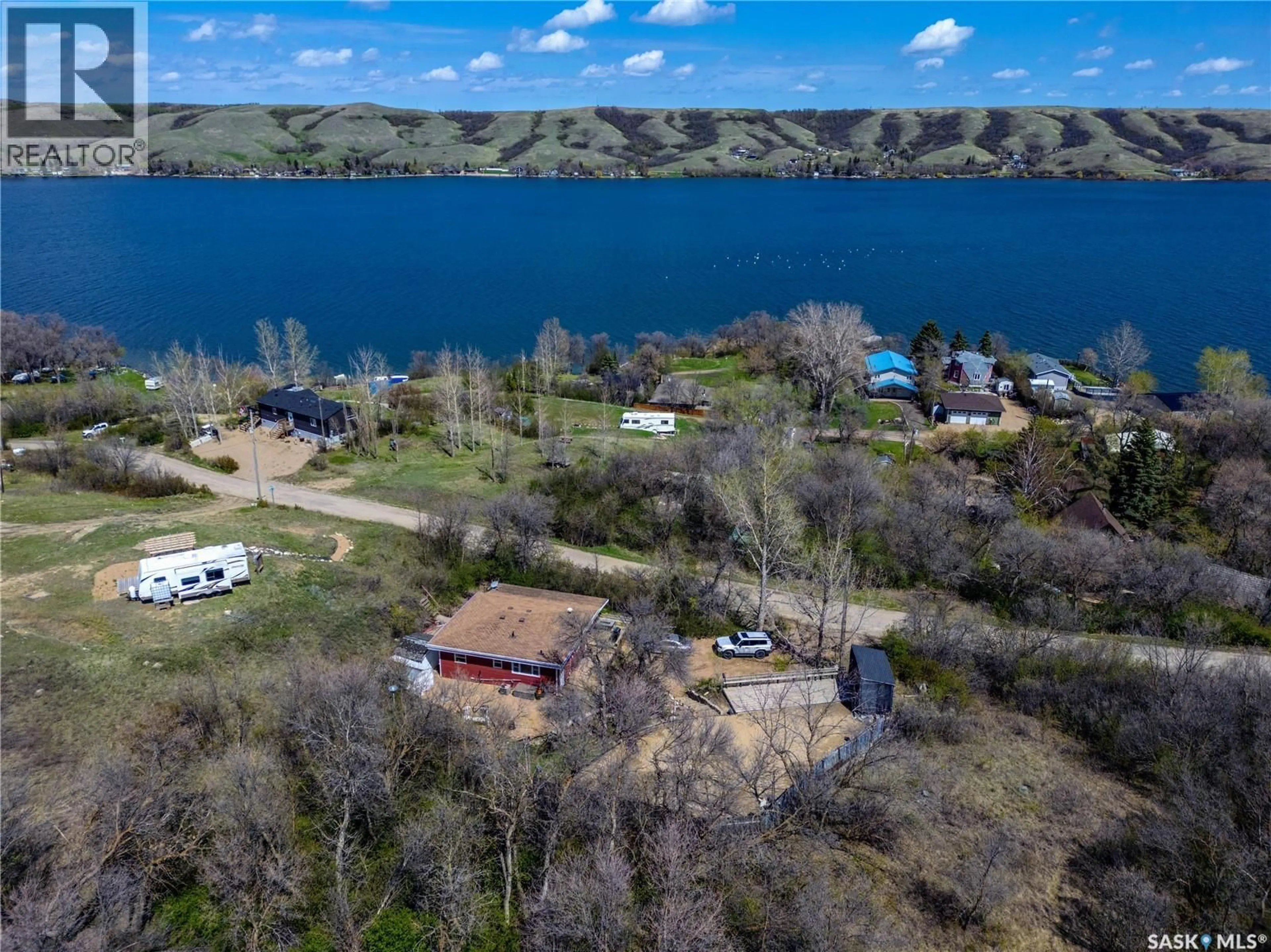A pic from outside/outdoor area/front of a property/back of a property/a pic from drone, water/lake/river/ocean view for 1041 TATANKA DRIVE, South Lake Saskatchewan S0H0R0