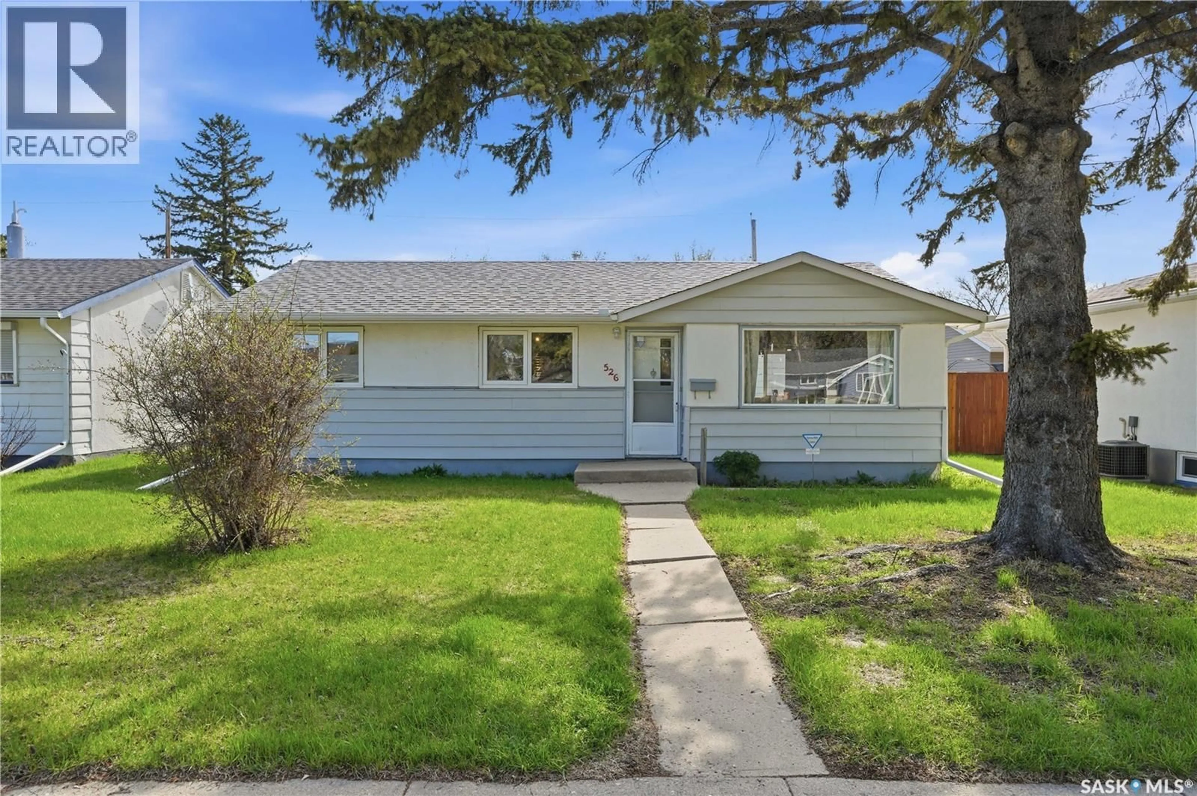 Home with vinyl exterior material, street for 526 V AVENUE, Saskatoon Saskatchewan S7M3E9
