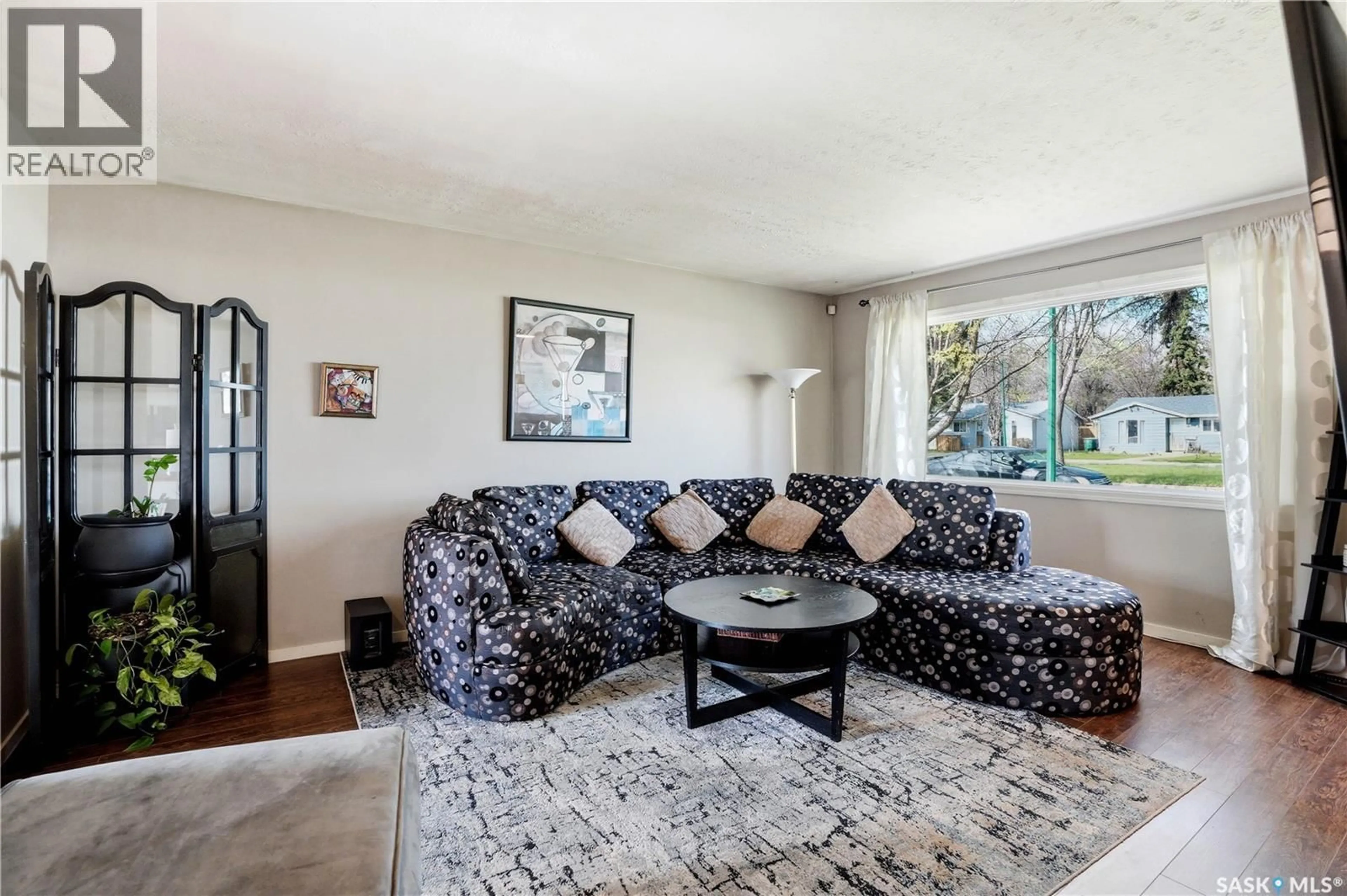 Living room with furniture, carpet floor for 526 V AVENUE, Saskatoon Saskatchewan S7M3E9