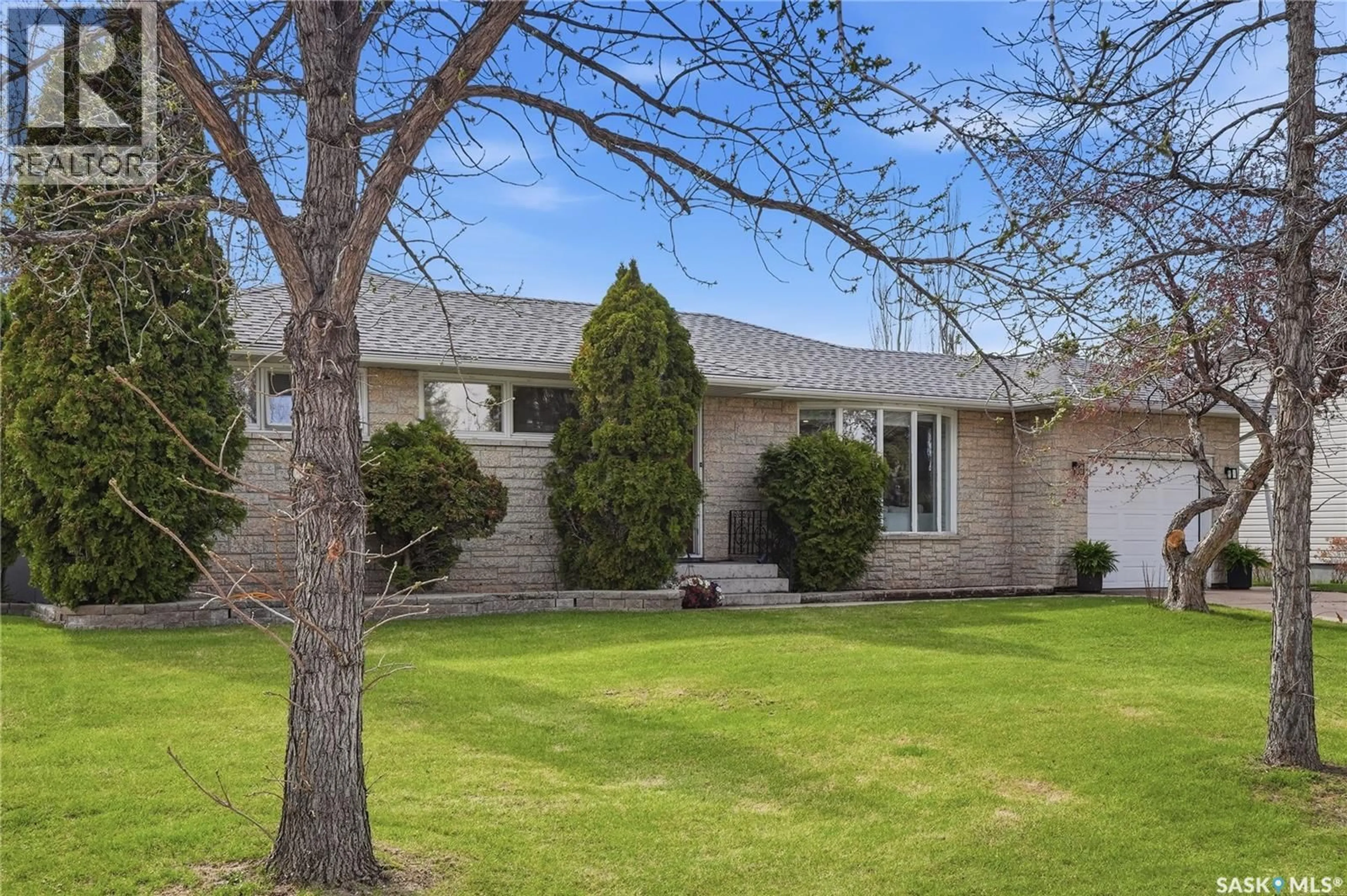 Home with brick exterior material, street for 1918 EWART AVENUE, Saskatoon Saskatchewan S7J1X7