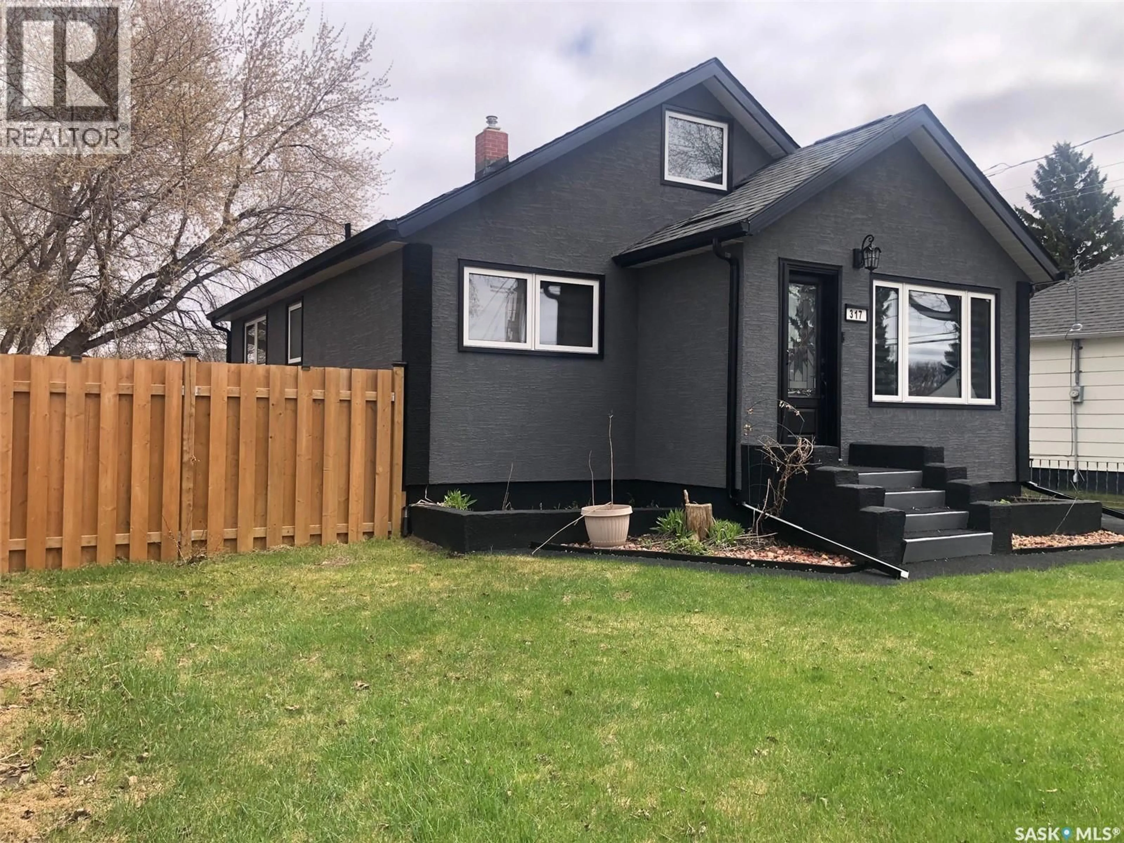 Home with vinyl exterior material, street for 317 MAPLE AVENUE, Yorkton Saskatchewan S3N1W9