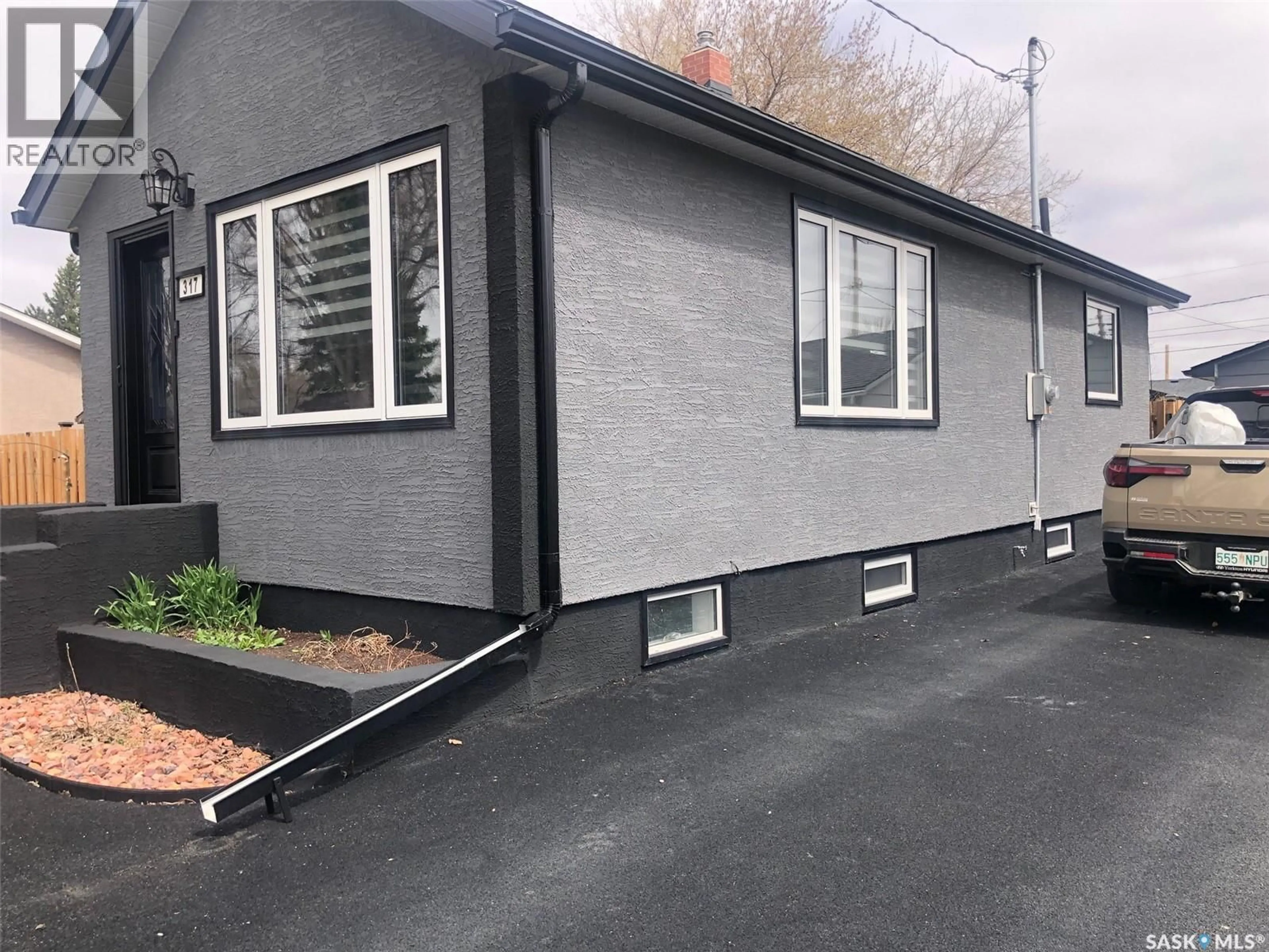Home with vinyl exterior material, street for 317 MAPLE AVENUE, Yorkton Saskatchewan S3N1W9