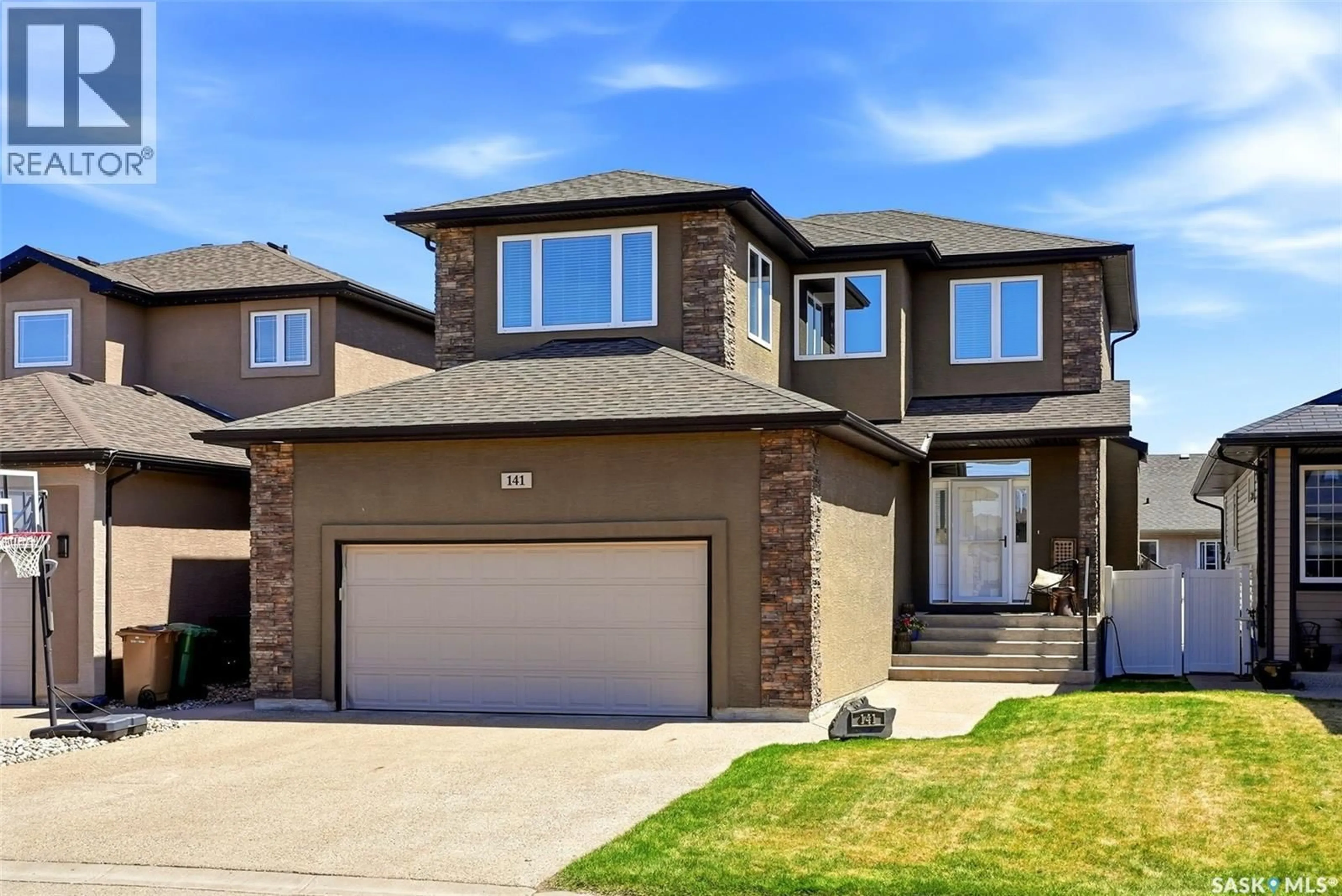 Home with brick exterior material, street for 141 OXBOW CRESCENT, Regina Saskatchewan S4Y0A7