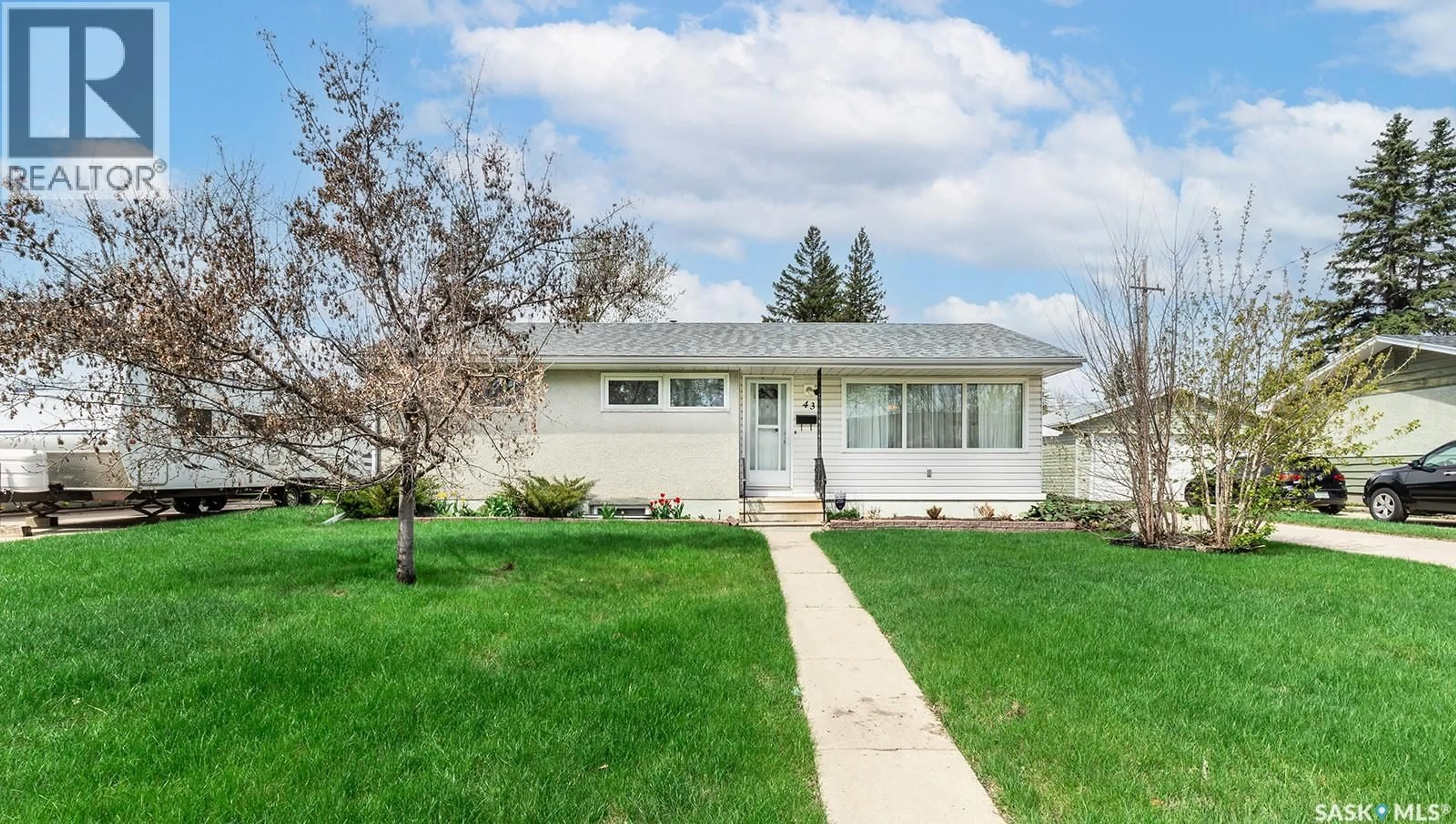 Home with vinyl exterior material, street for 43 LINDSAY DRIVE, Saskatoon Saskatchewan S7H3E2