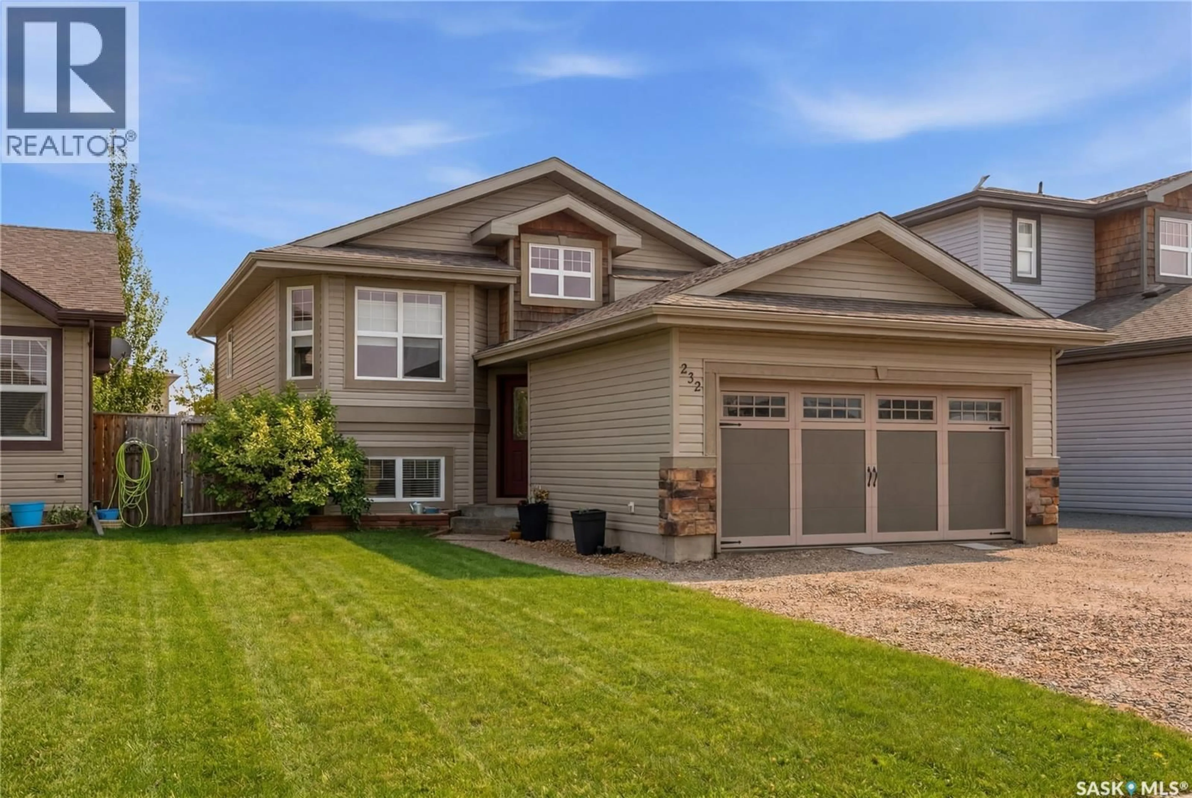 Home with vinyl exterior material, street for 232 ENNS CRESCENT, Martensville Saskatchewan S0K0A2