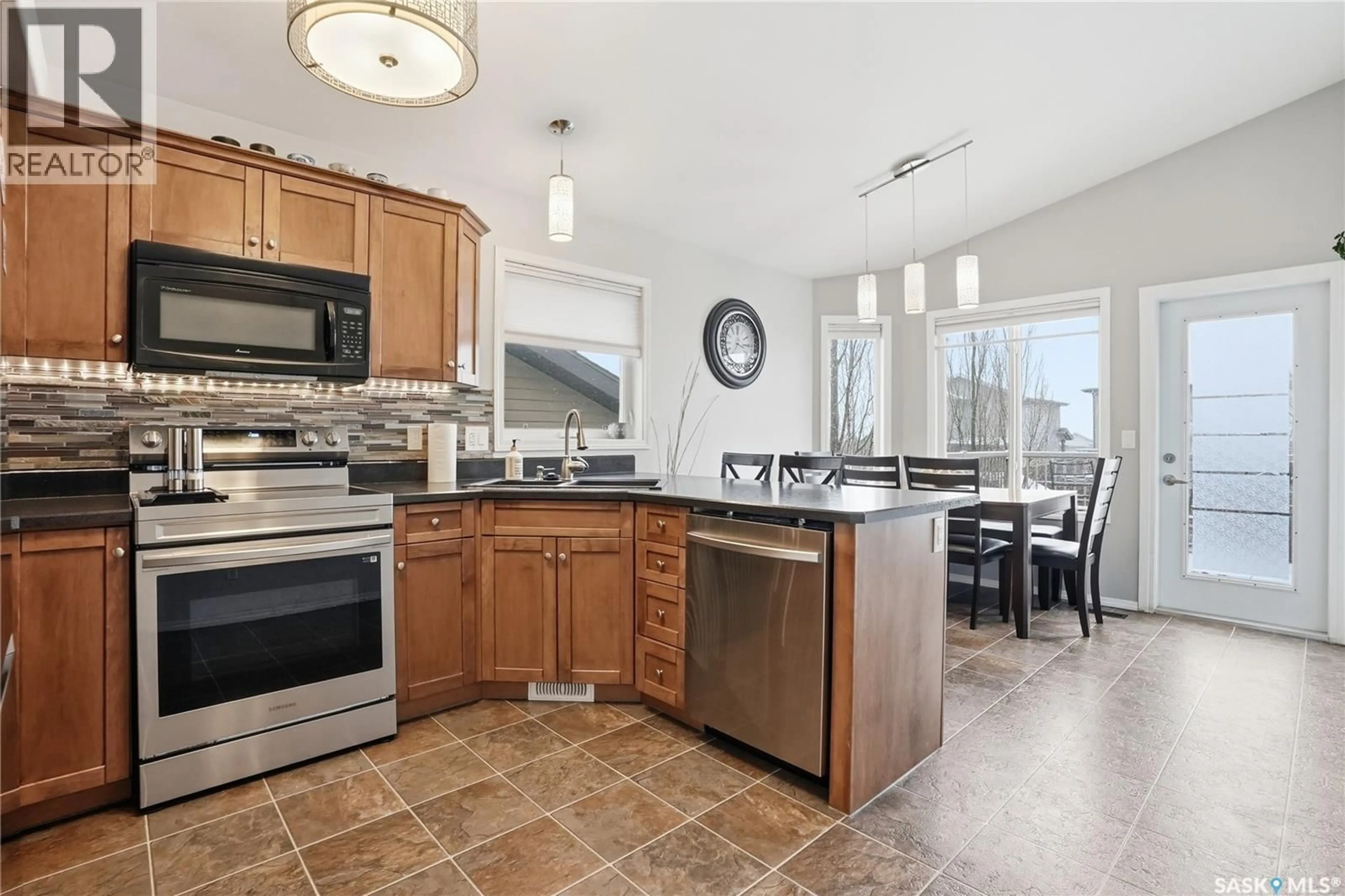 Open concept kitchen, ceramic/tile floor for 232 ENNS CRESCENT, Martensville Saskatchewan S0K0A2