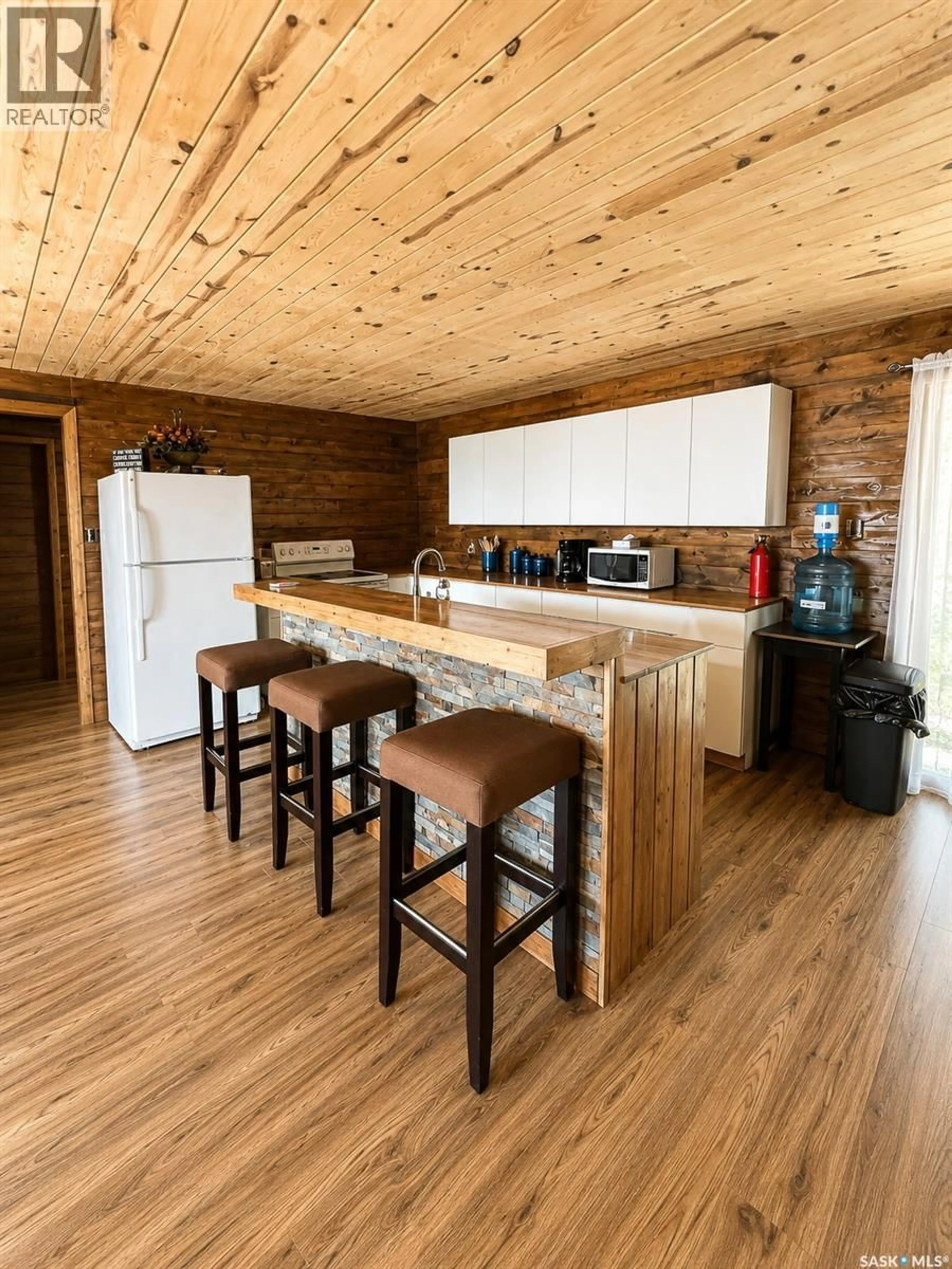 Open concept kitchen, wood/laminate floor for Sub 5 - 13 CABIN, Meeting Lake Saskatchewan S0M2L0