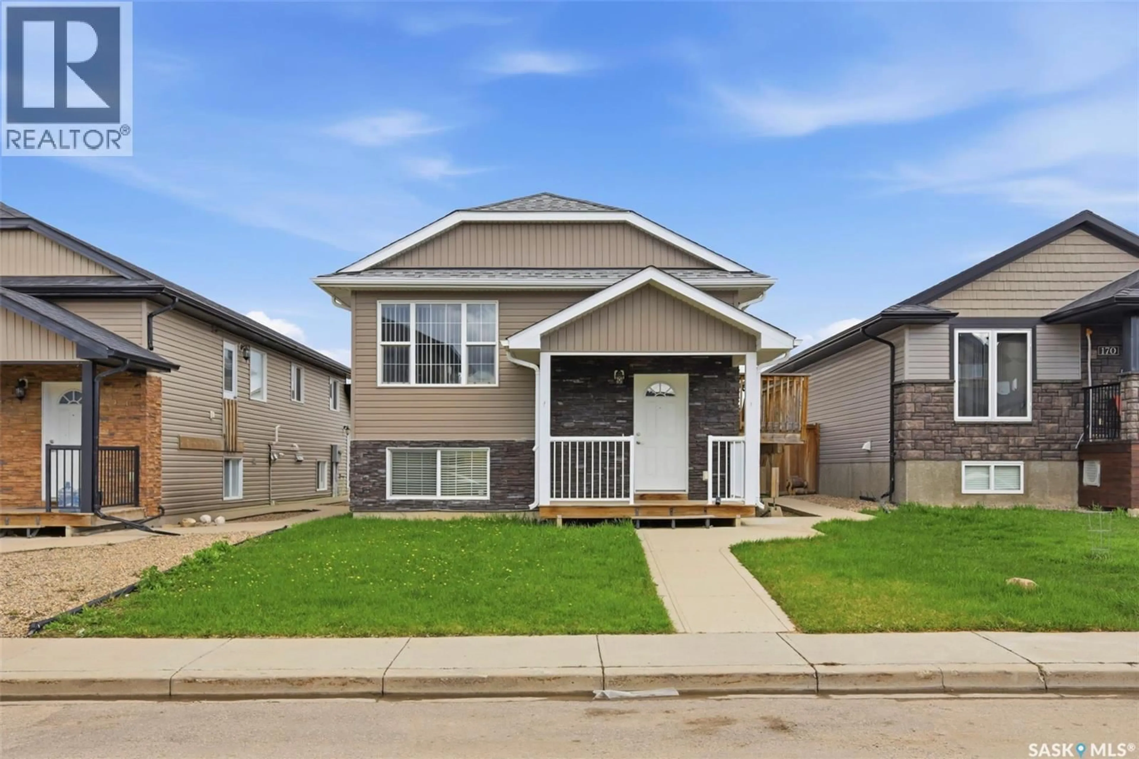 Home with vinyl exterior material, street for 166 RAJPUT WAY, Saskatoon Saskatchewan S7W0L5
