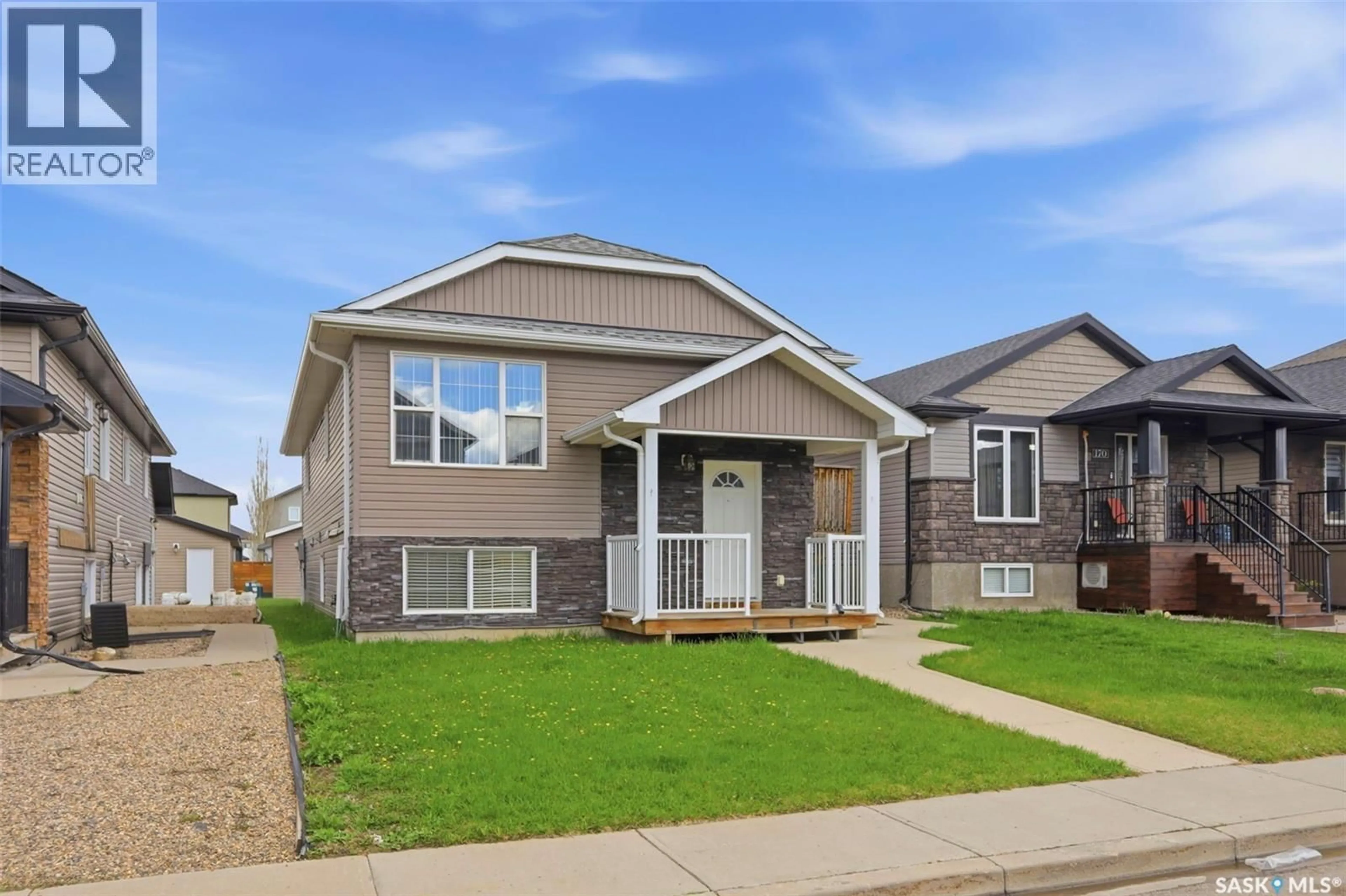 Home with vinyl exterior material, street for 166 RAJPUT WAY, Saskatoon Saskatchewan S7W0L5