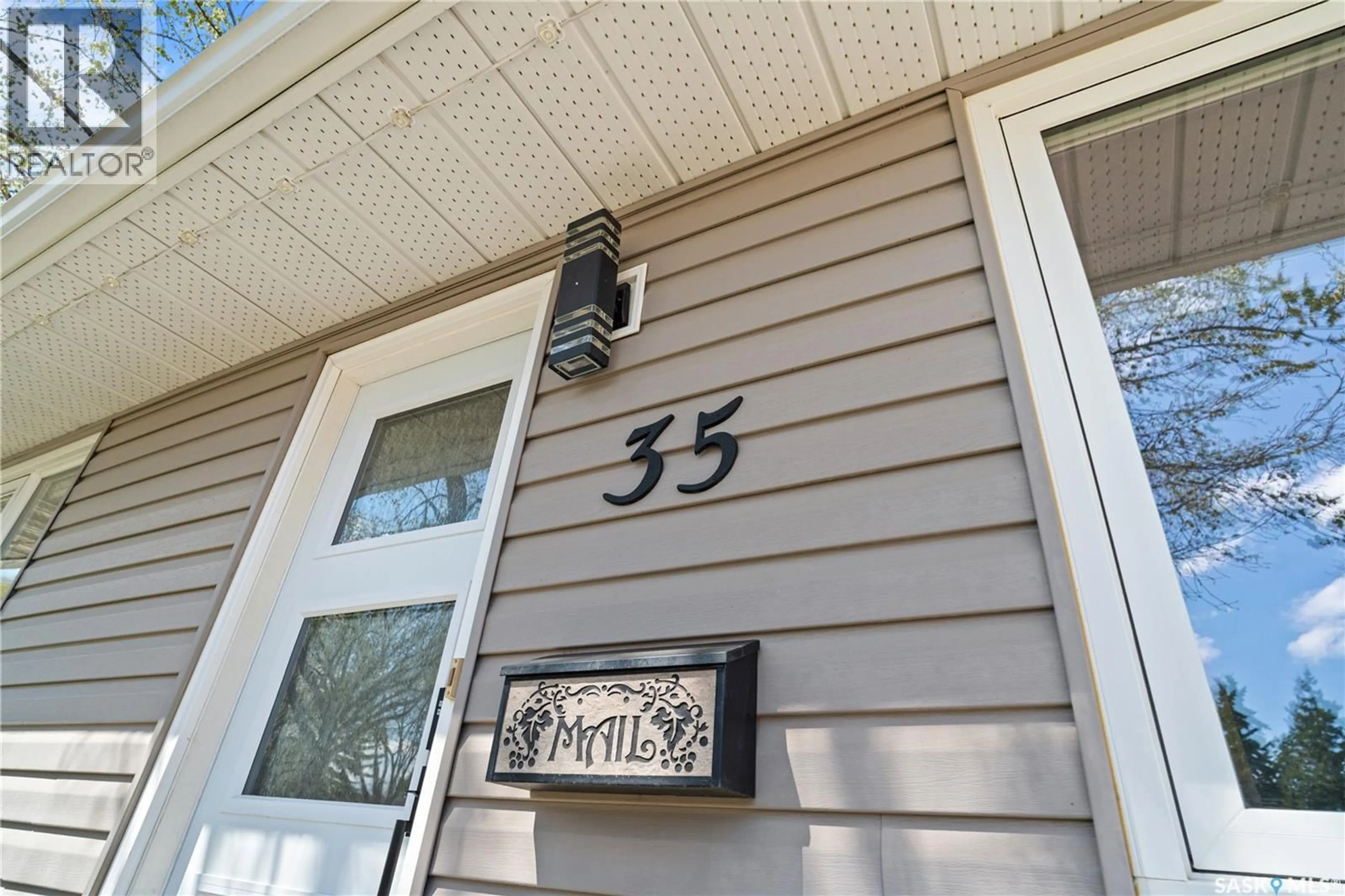Home with vinyl exterior material, street for 35 SYMONS PLACE, Regina Saskatchewan S4X1M7