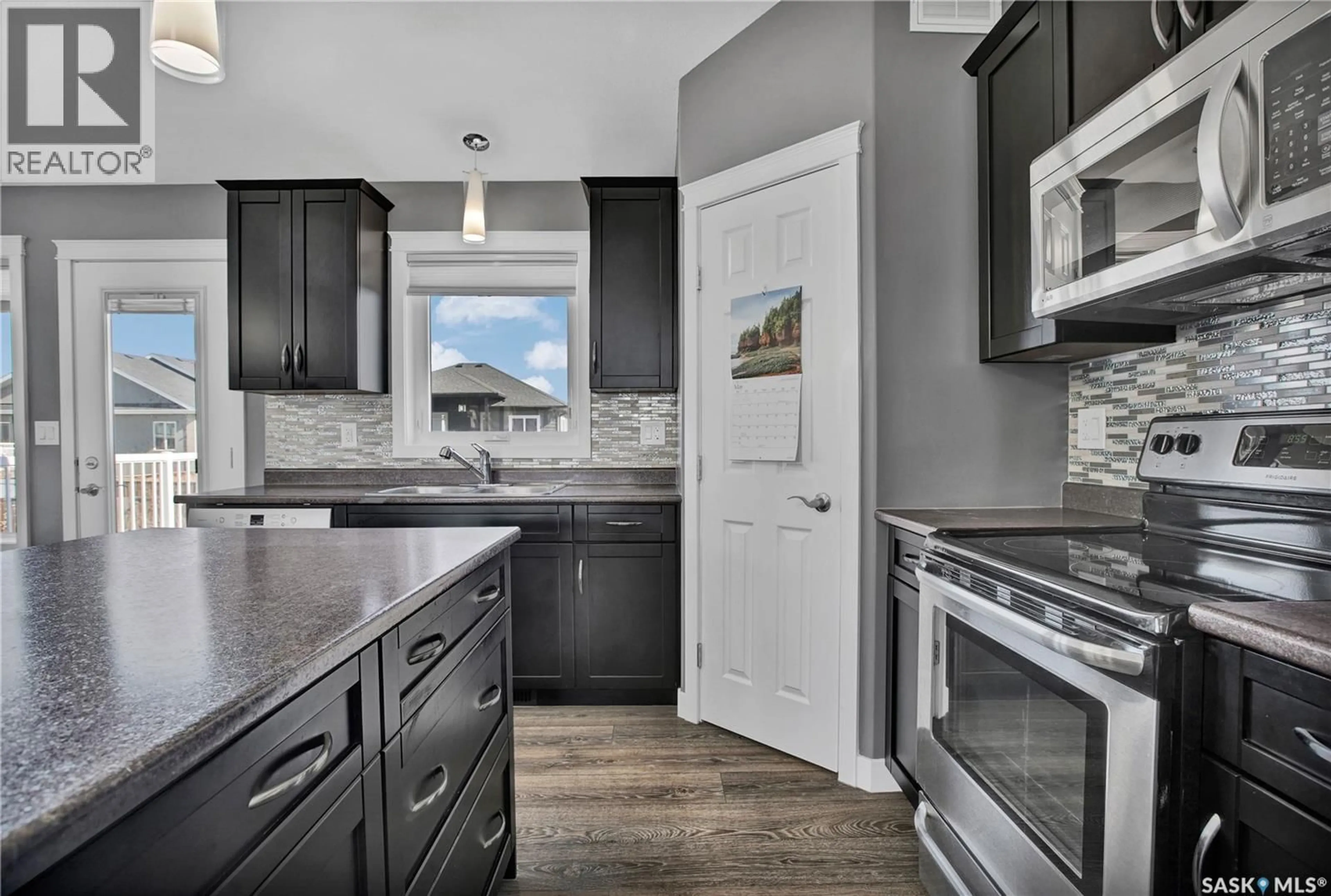 Open concept kitchen, unknown for 406 SPRUCE STREET, Warman Saskatchewan S0K4S2