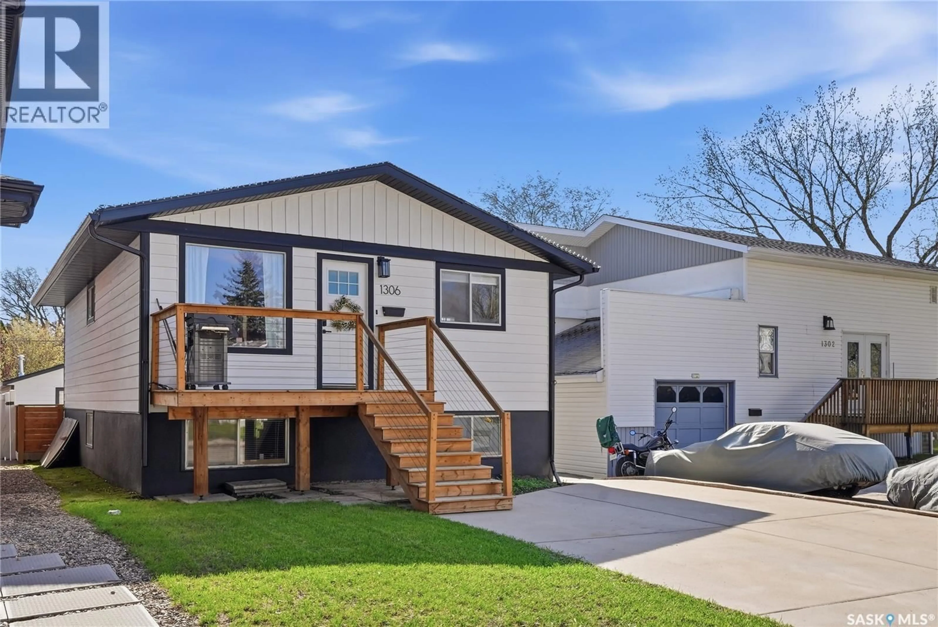 Home with vinyl exterior material, street for 1306 6TH AVENUE, Saskatoon Saskatchewan S7K2T8