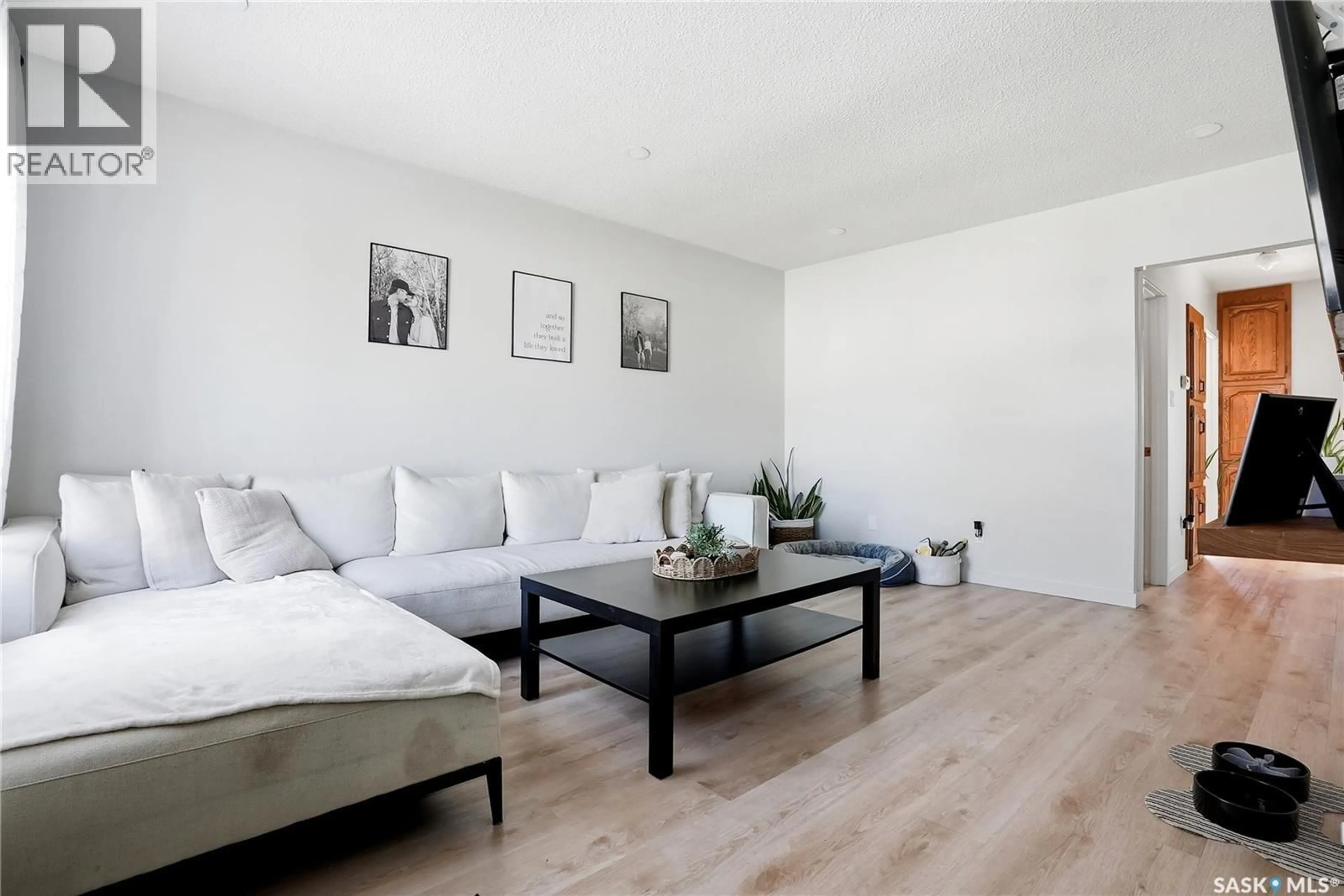 Living room with furniture, wood/laminate floor for 1306 6TH AVENUE, Saskatoon Saskatchewan S7K2T8