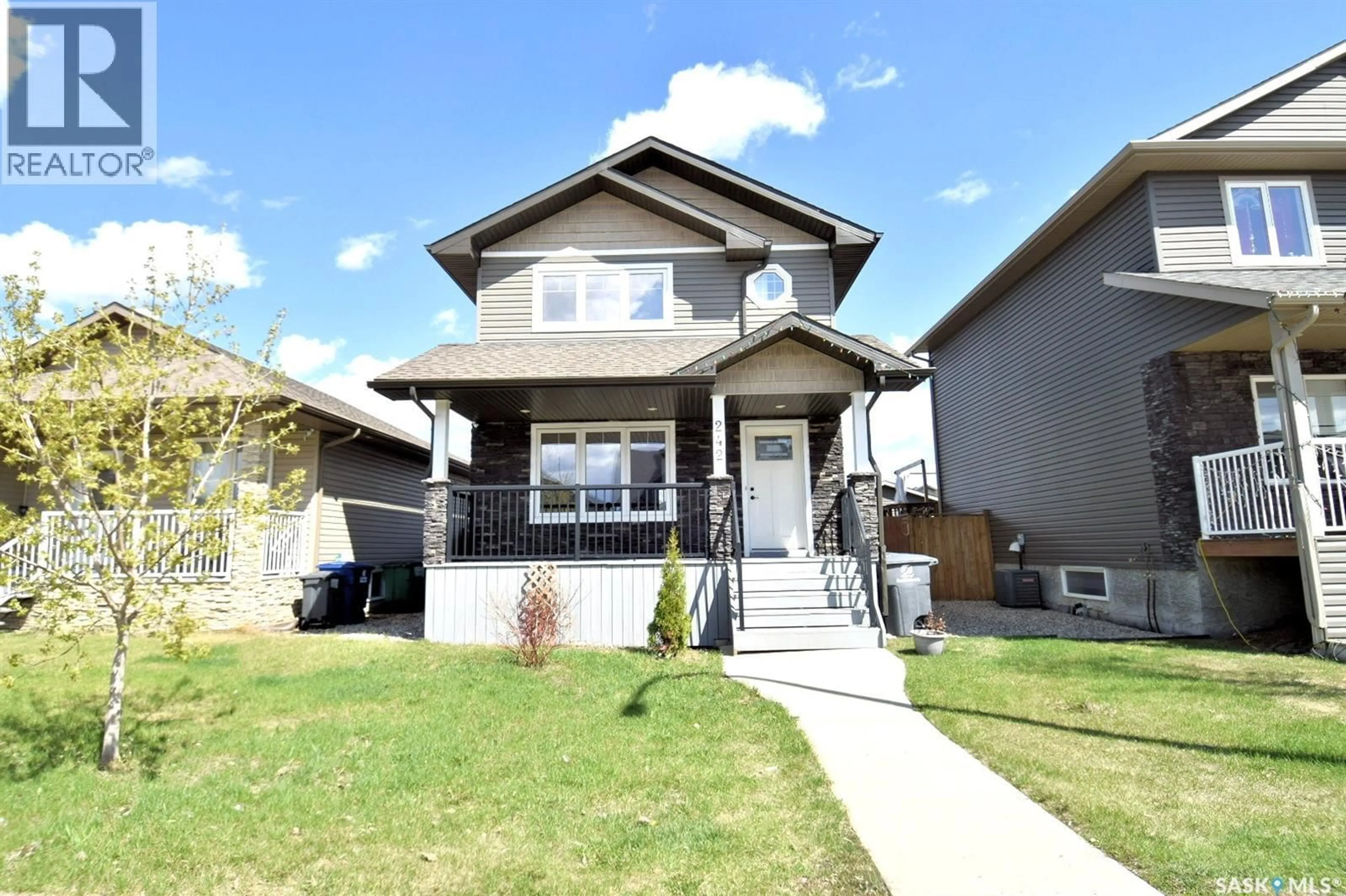 Home with vinyl exterior material, street for 242 GEARY CRESCENT, Saskatoon Saskatchewan S7R0E6