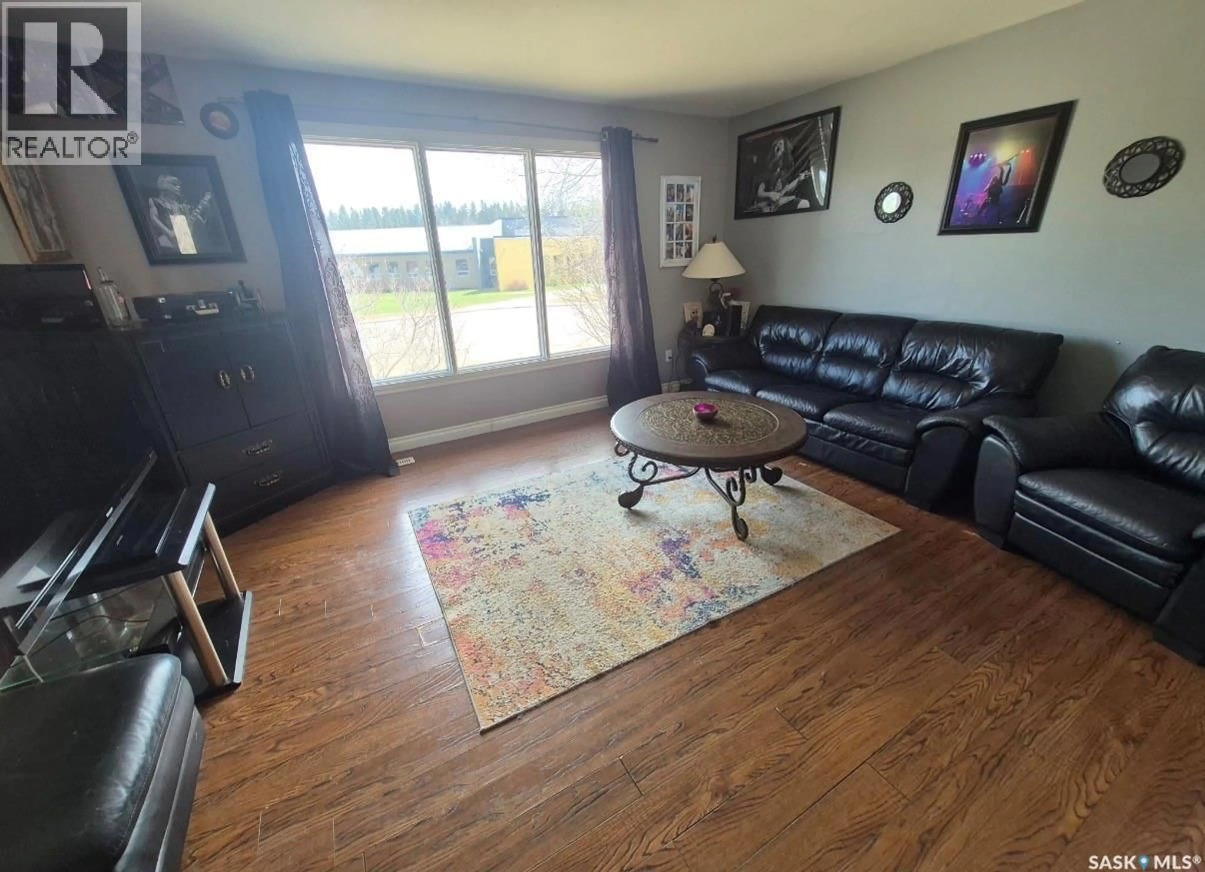 Living room with furniture, wood/laminate floor for 114 7TH AVENUE, Big River Saskatchewan S0J0E0